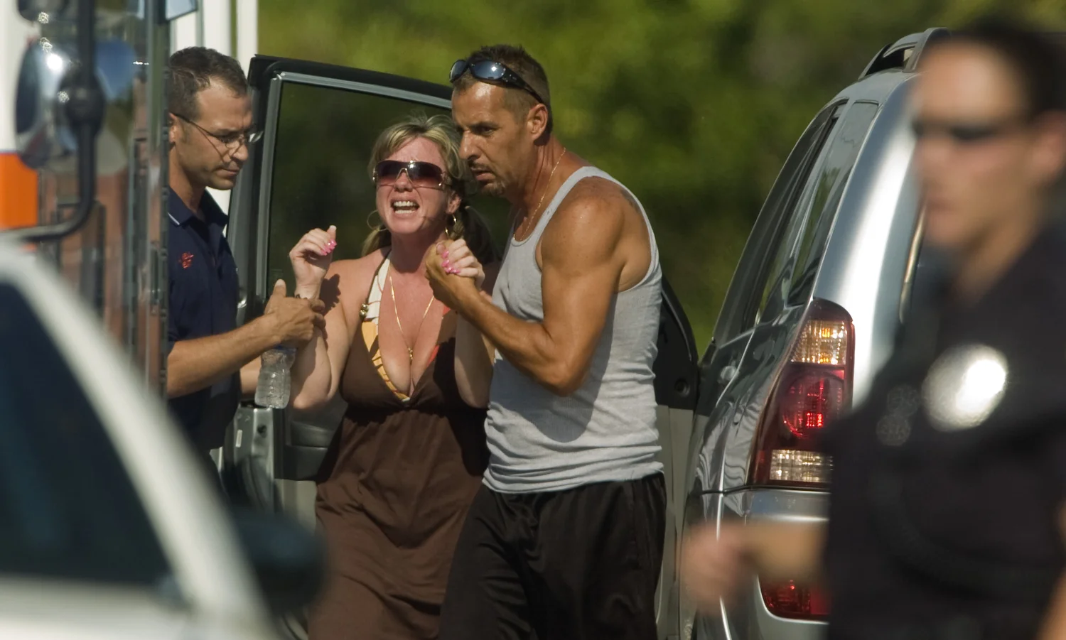  Connie Brown, the sister-in-law of a woman who was killed in a murder suicide, is consoled after finding out about the double shooting. 
