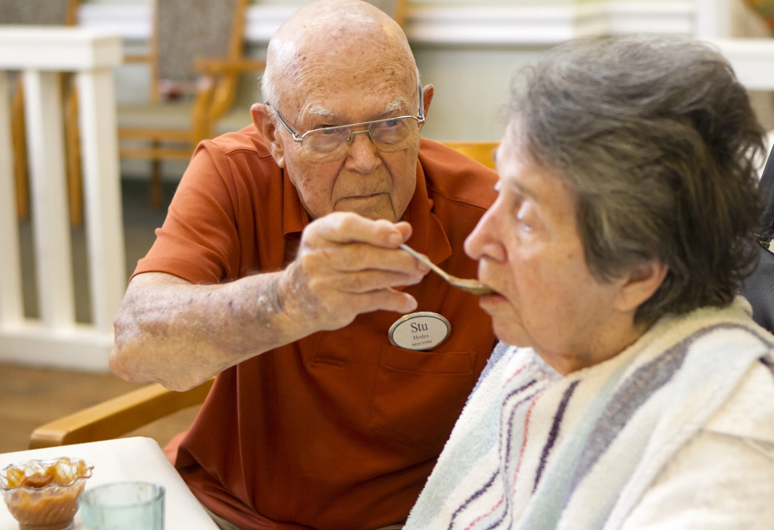  Stuart Hodes feeds his wife Helen during one of their afternoon visits. Helen is in the end stage of Alzheimer's disease. 