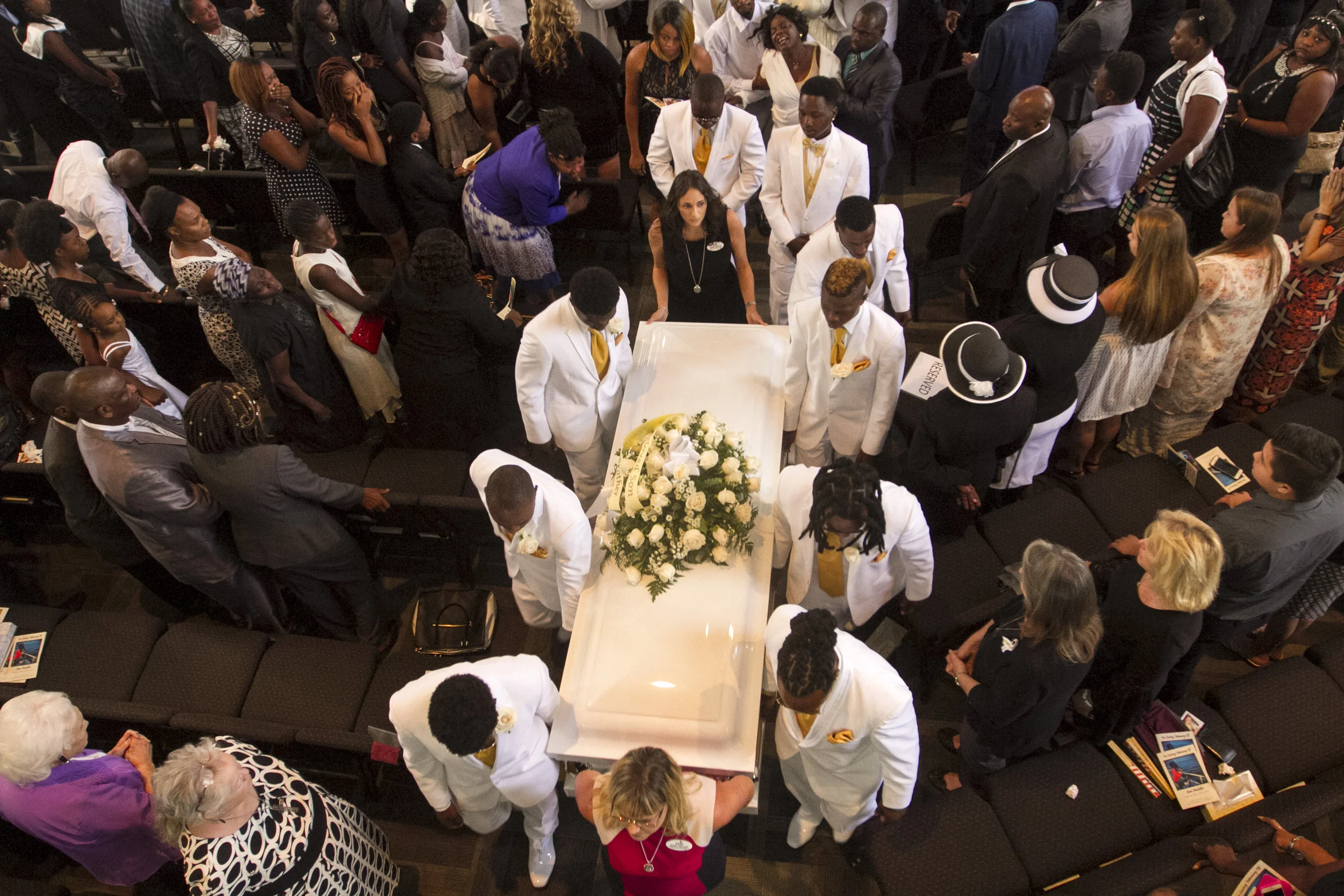  The uncles and brothers of Sean Archilles carry his casket out of CityGate Ministries on Saturday, August 6, 2016, following his funeral in Fort Myers. Archilles, 14, was shot and killed outside Club Blu on July 25, 2016. 