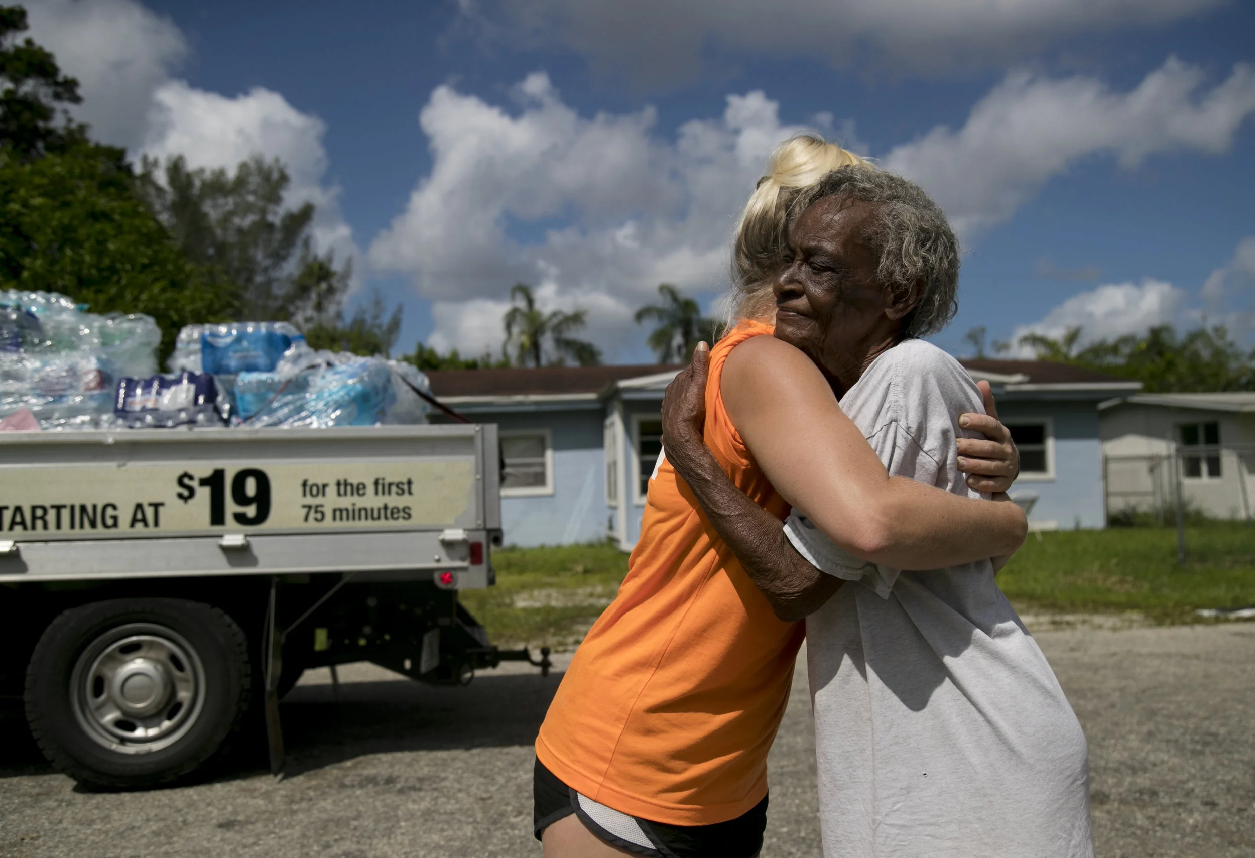  Penny Fletcher thanks Amanda Schoedel of Next Level Church after church volunteers gave her cases of water on Tuesday, September 12, 2017, in the Harlem Lakes community in Fort Myers. Residents were without power after Hurricane Irma. 