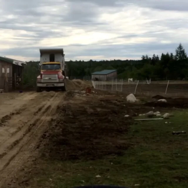 Dumping twenty loads of grit for the road