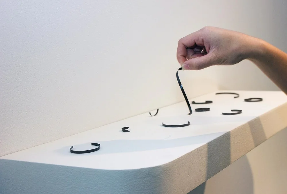 Engram (In Their Words) 2015 3" x 36" x 5" spliced cassette tape, cleat shelf
