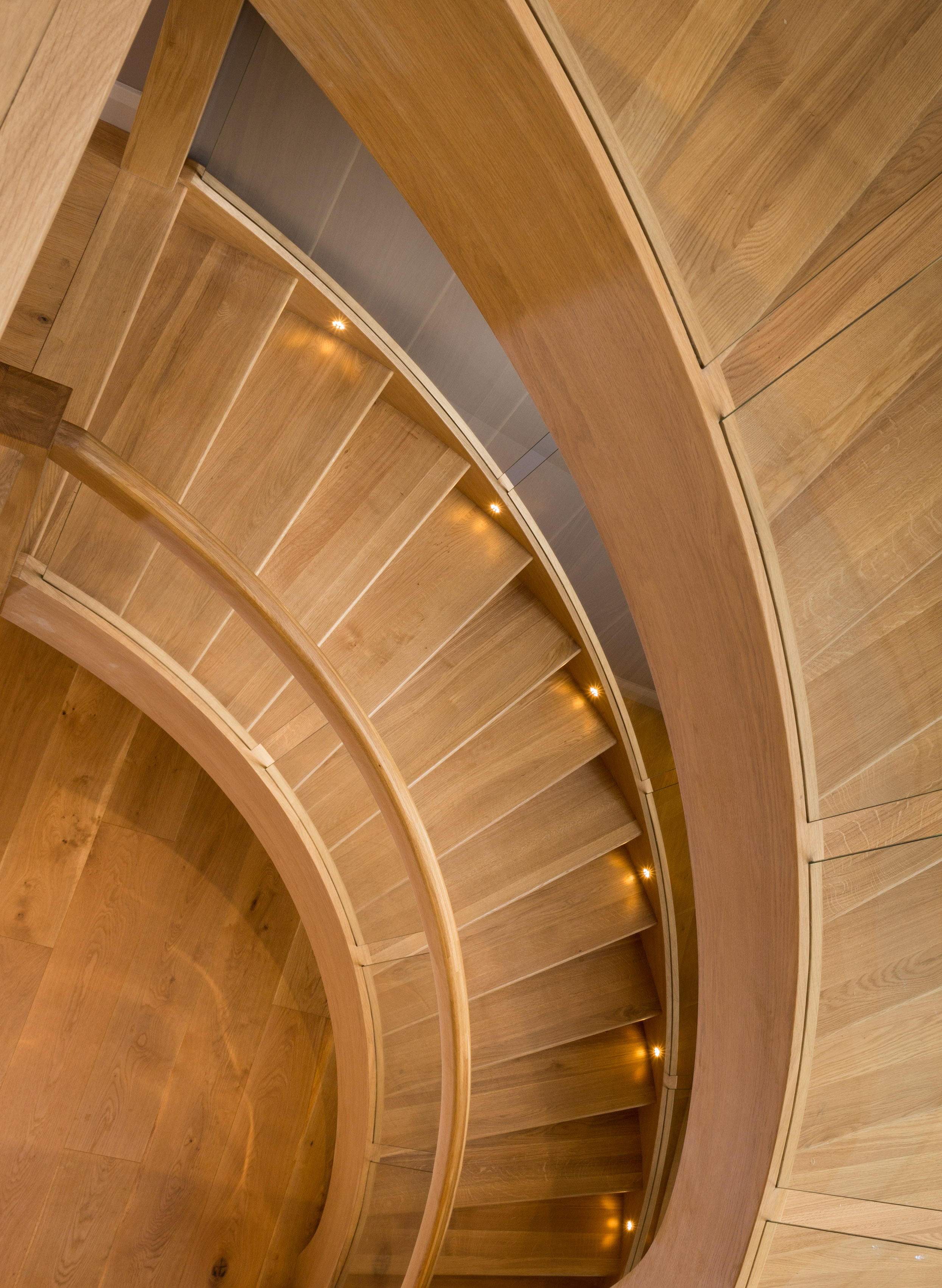  A view down the elegant wooden staircase that sits in proudly in the centre of the home. 