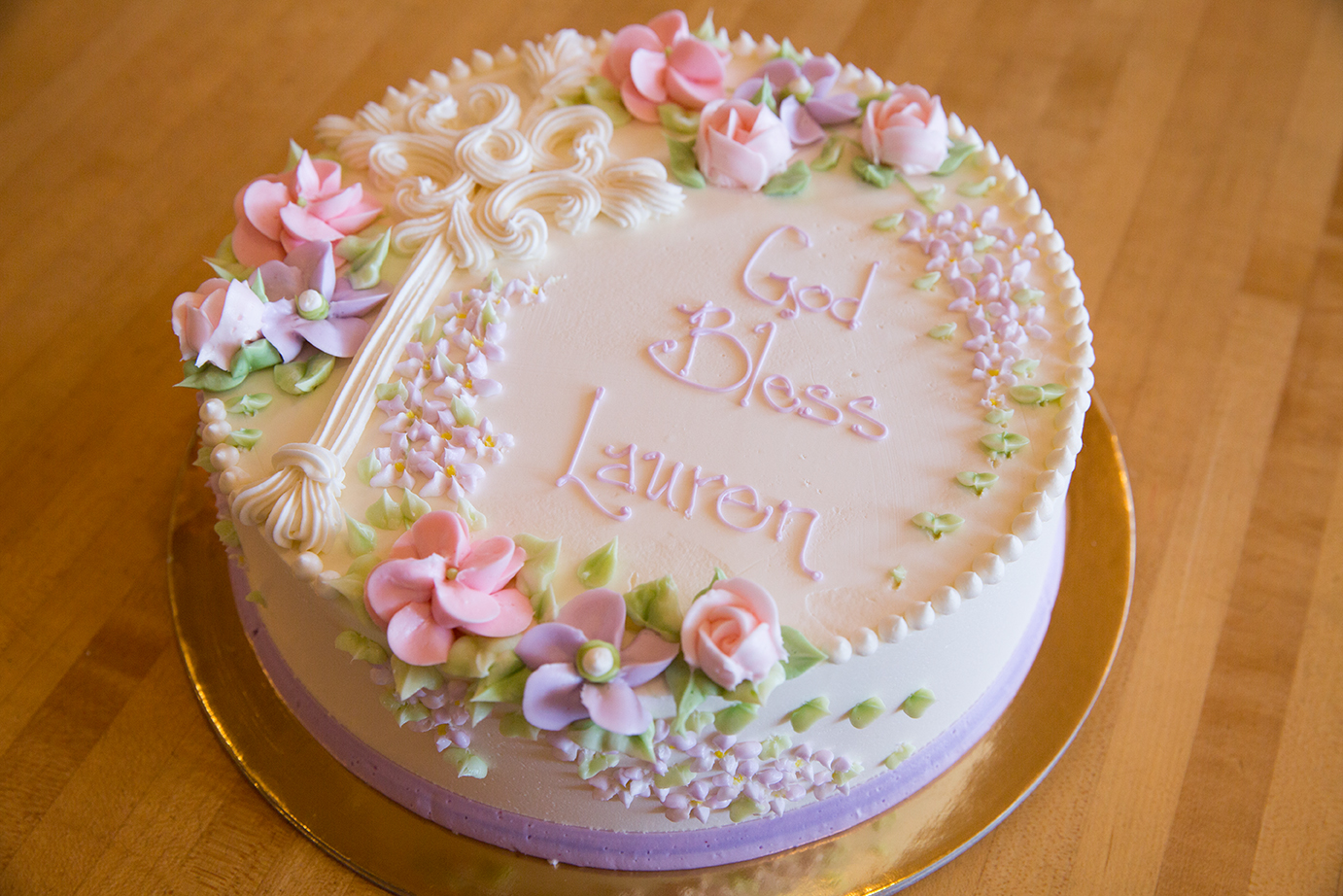 White Buttercream Cross with Daisies and Roses