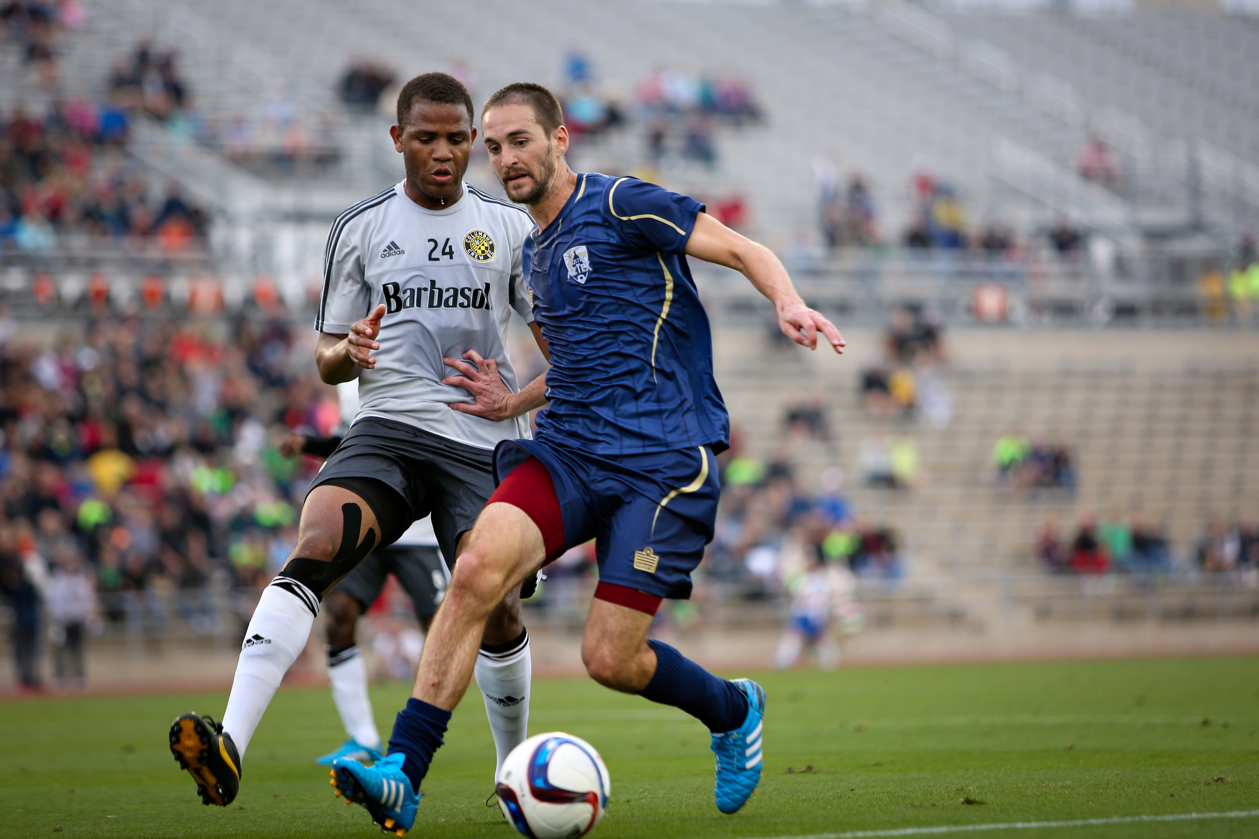 Drew Yates, midfielder for Austin Aztex, prepares to kick the ball during a game against Columbus Crew SC at the ATX Pro Challenge tournament on Feb. 15.