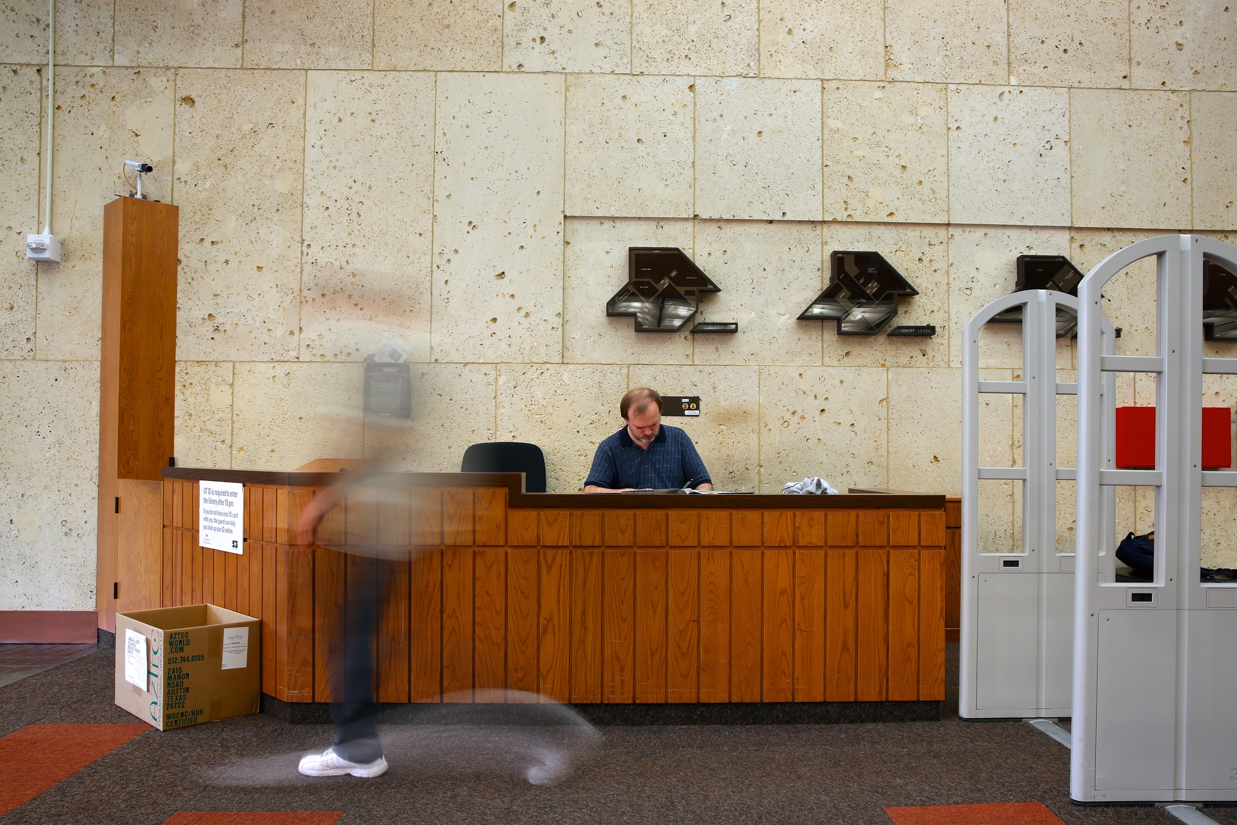 Custard completes his daily sudoku puzzles during his break at the guard's desk.