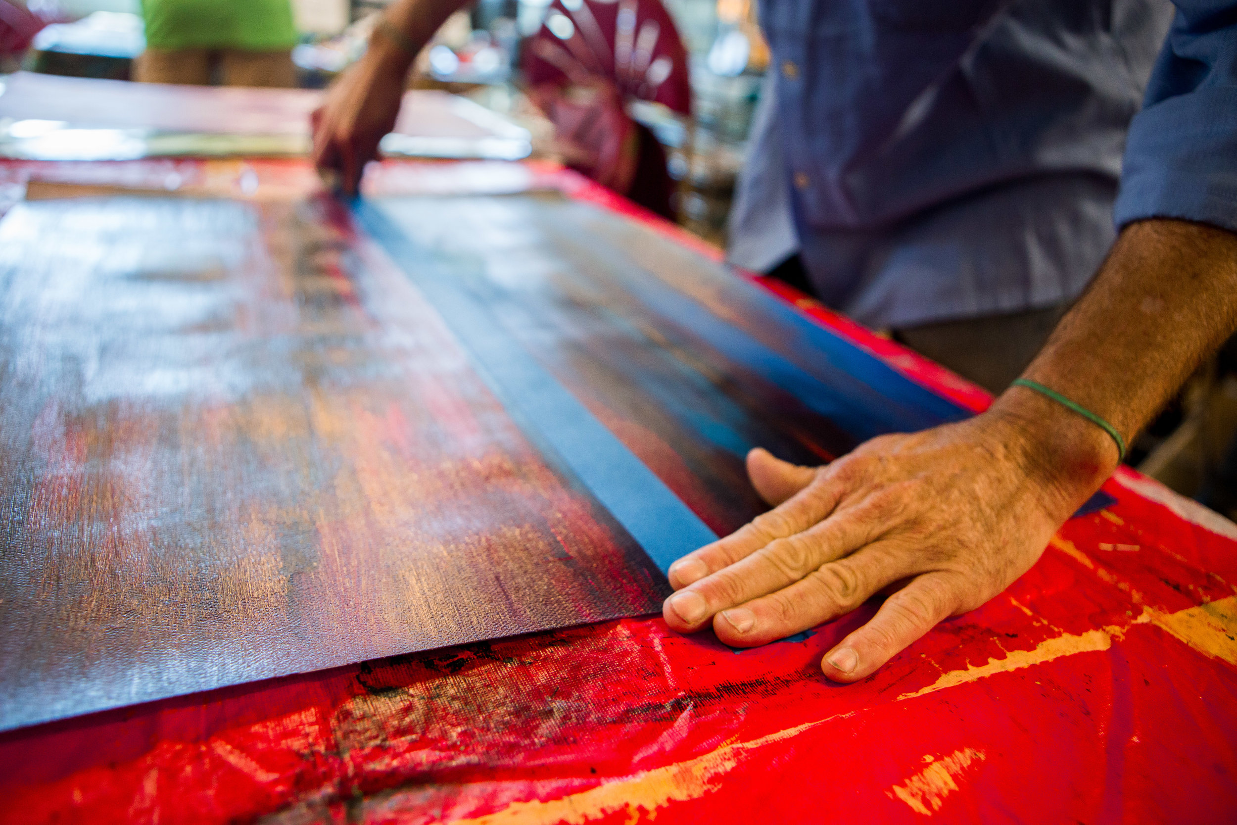 Schumaker works diligently on one of his paintings. 