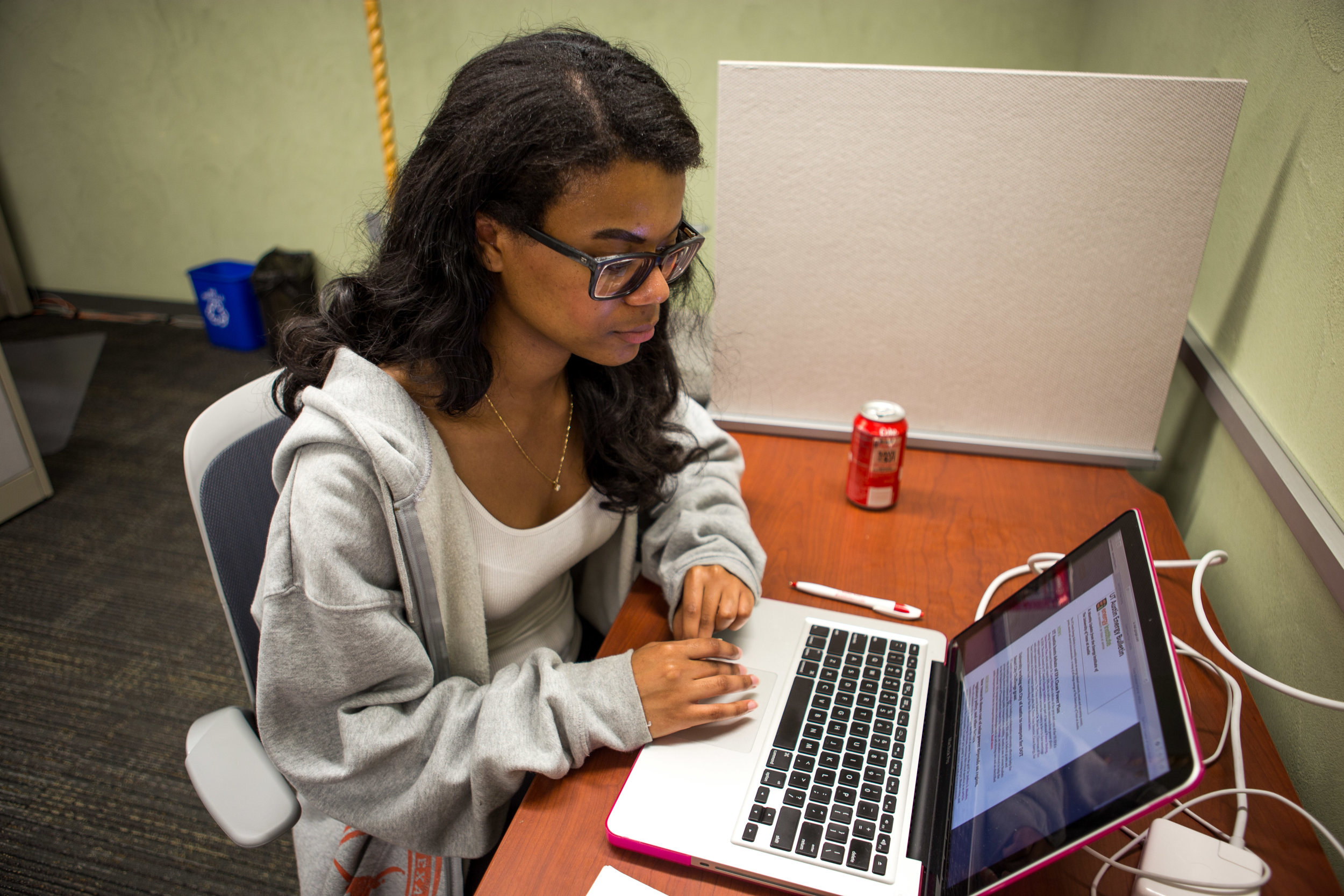 Journalism junior Alex Samuels types on her computer at her paid internship.