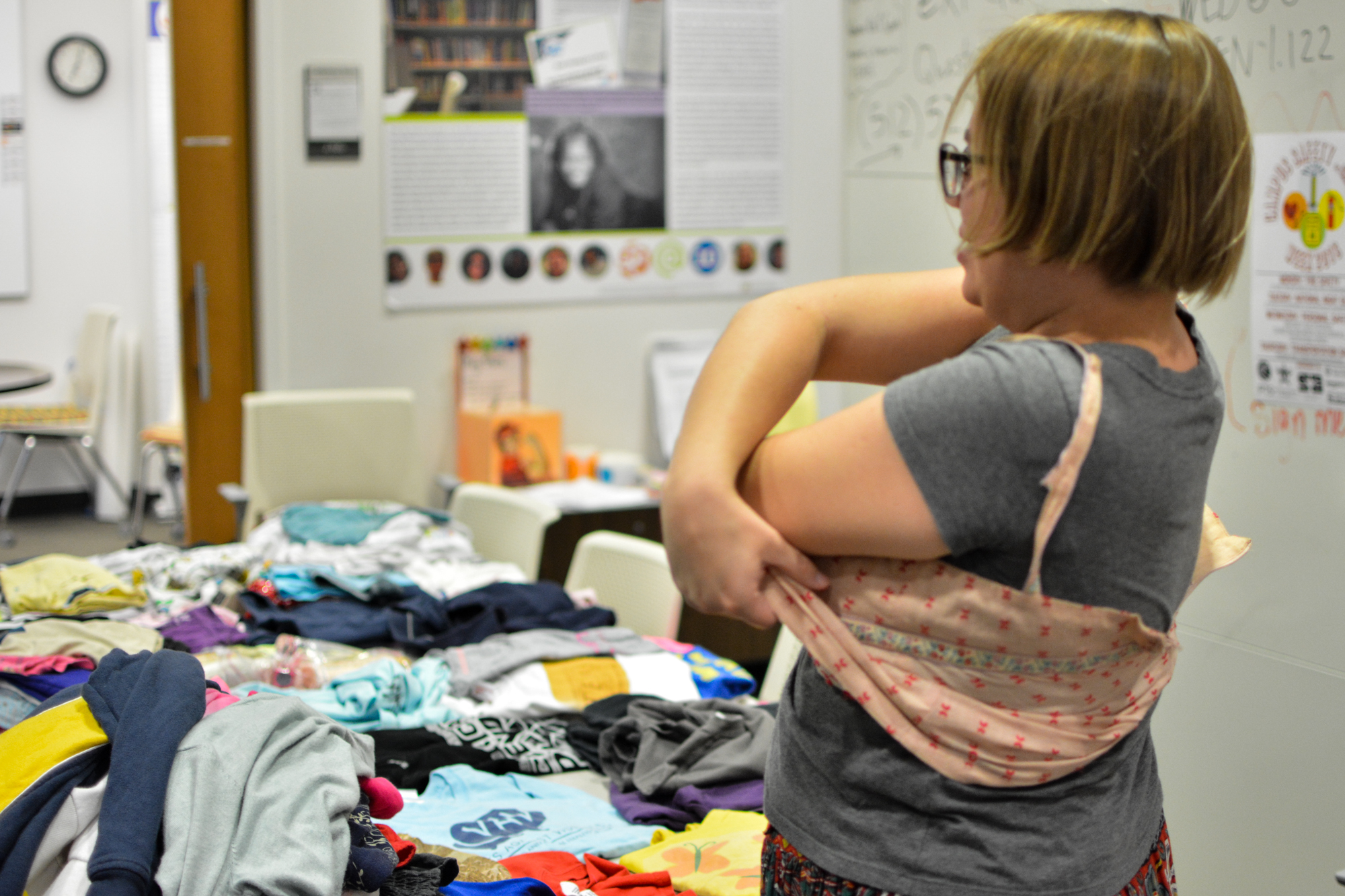 Many people, including volunteers, who attended the clothing swap got tried on various clothing items with the hopes of adding them to their own personal wardrobe.
