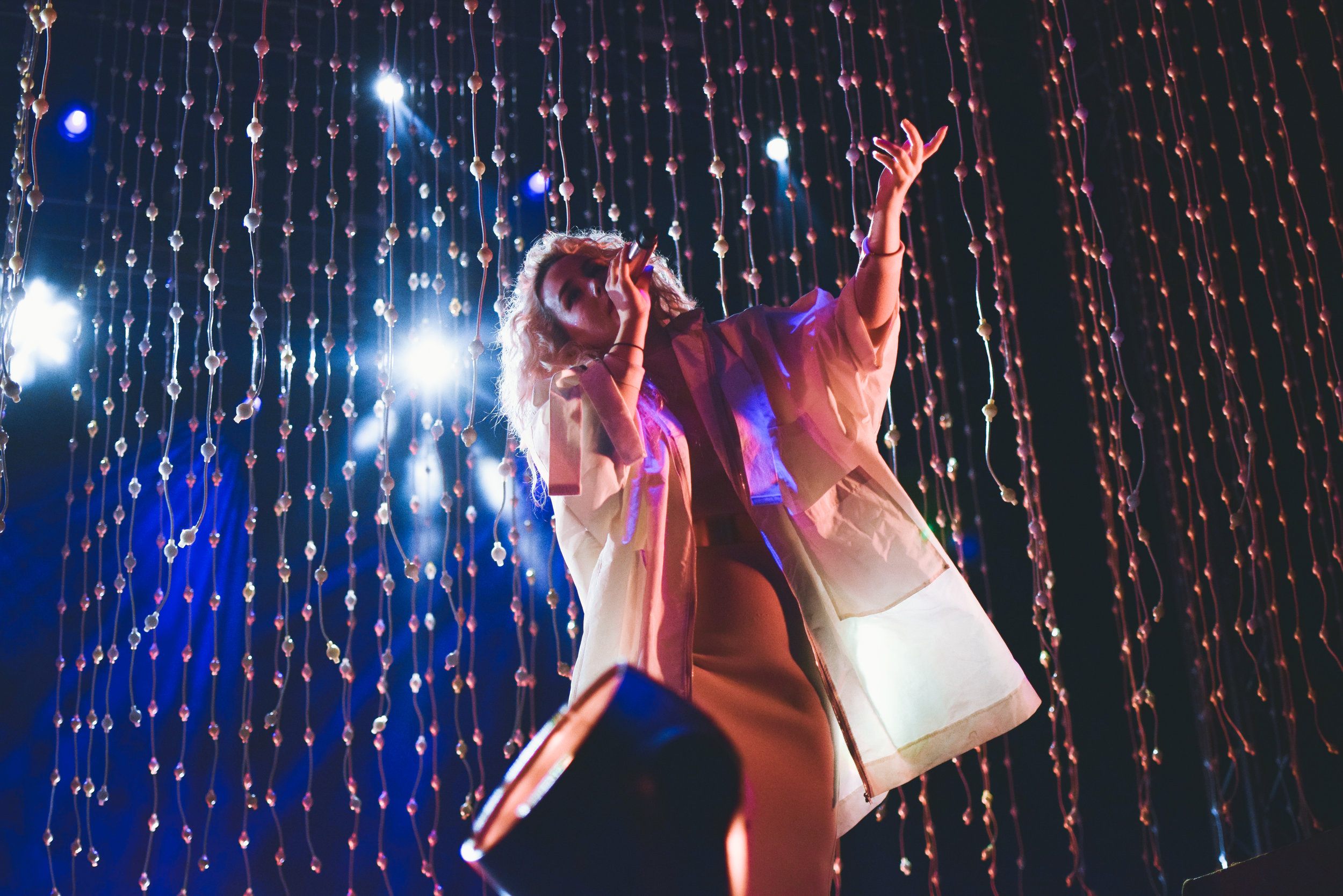Megan James of Purity Ring sings to the crowd.