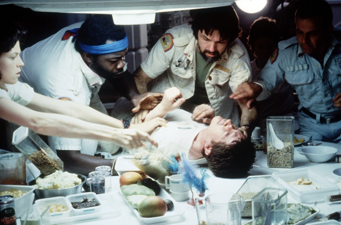A still from “Alien” (1979), just before the chest of a crew member bursts, creating the films’ dire conflict. Photo courtesy of cinemablography.com.