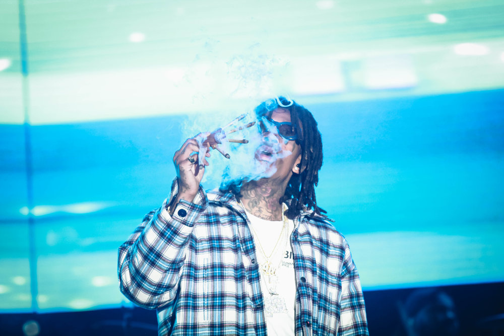   Wiz Khalifa's started his set by smoking five blunts in front of the chanting crowd.  