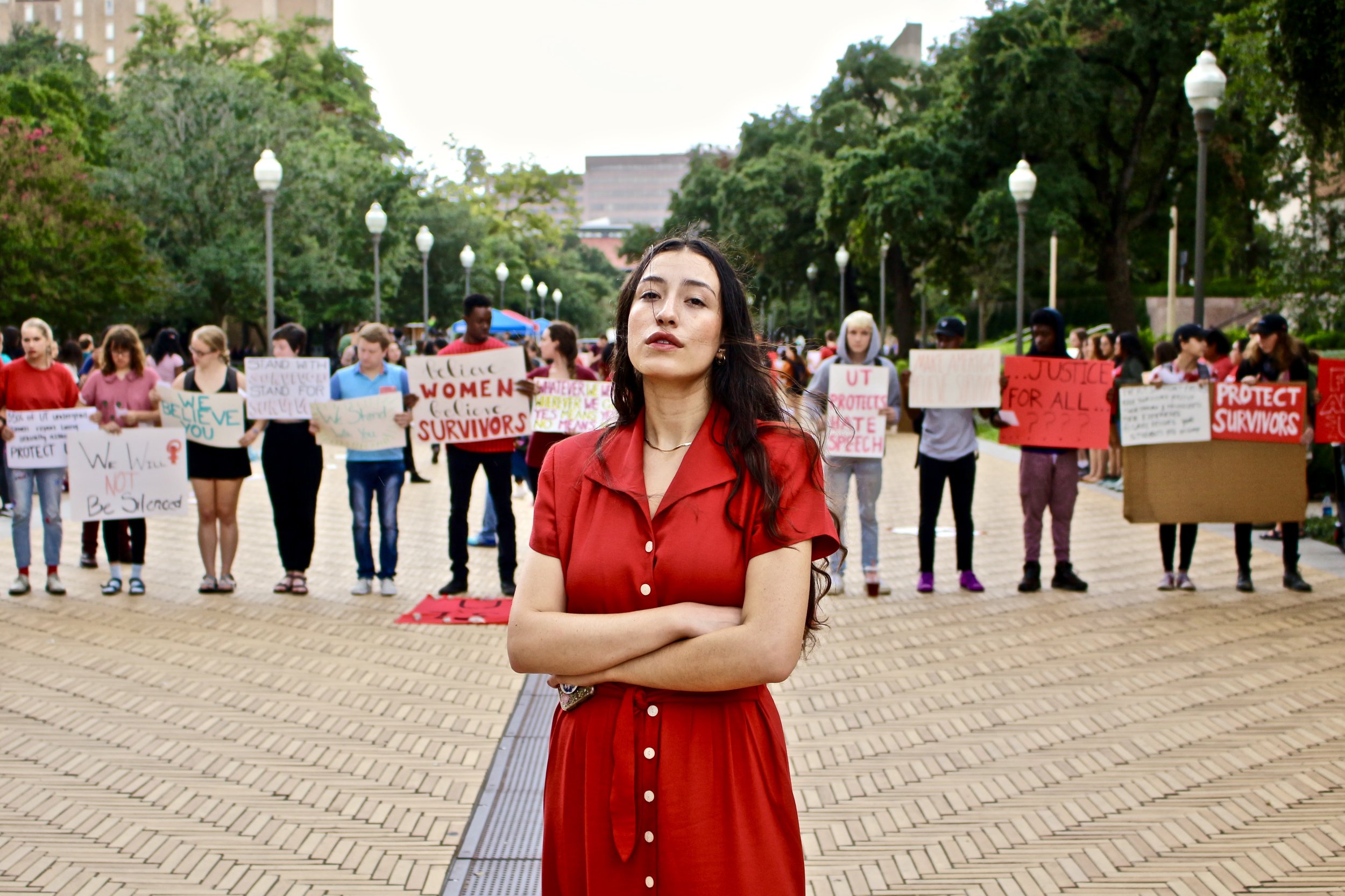 Gabriela Garza, Jolt UT chapter president, stands in solidarity with students at the “Stand with Survivors” rally on Tuesday, Oct. 9.