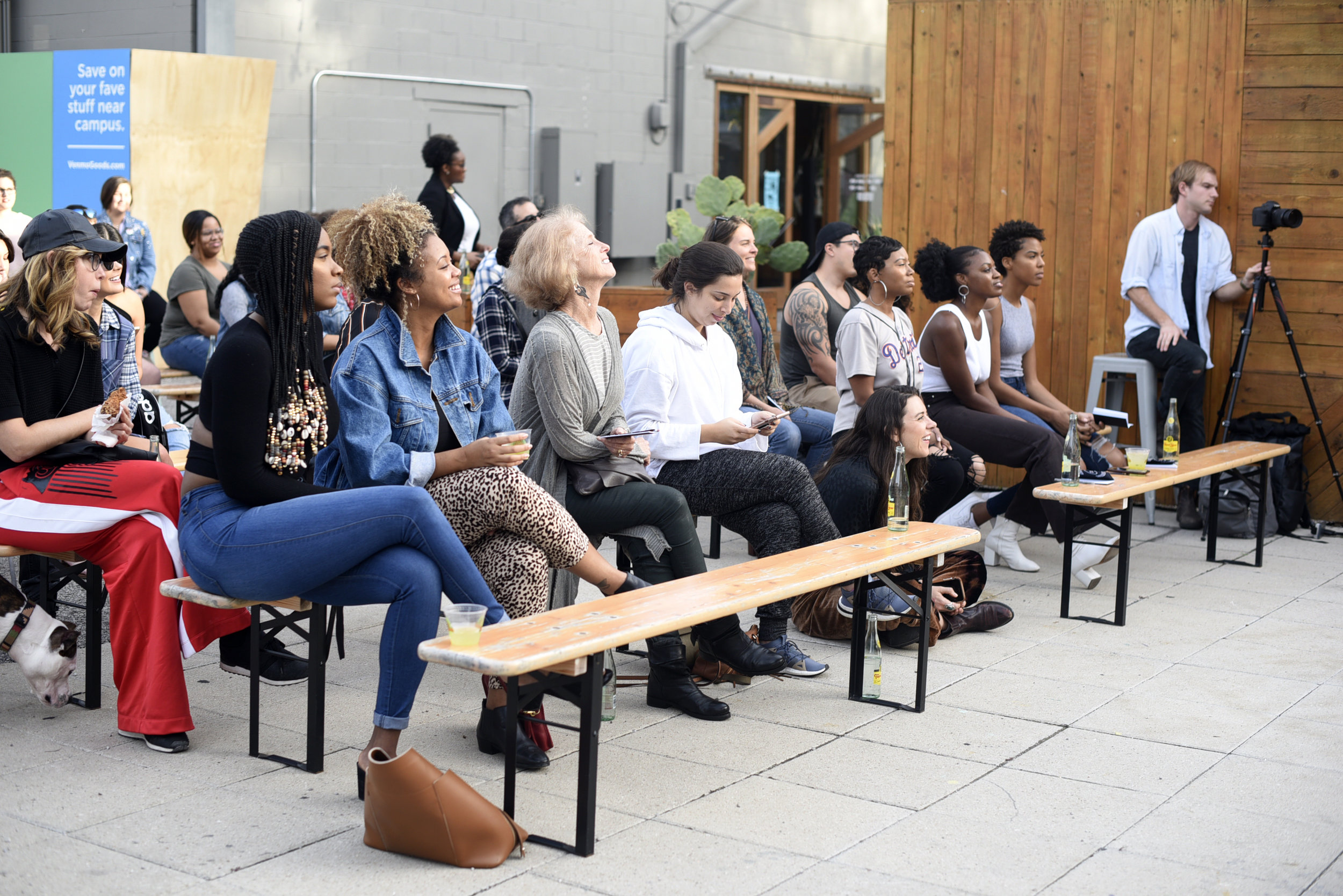 The audience attentively listens to the panel at the intimate Space 24 Twenty location.
