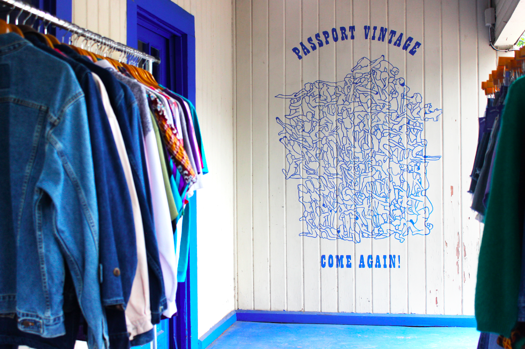 A painted mural welcomes customers and encourages them to come back again.