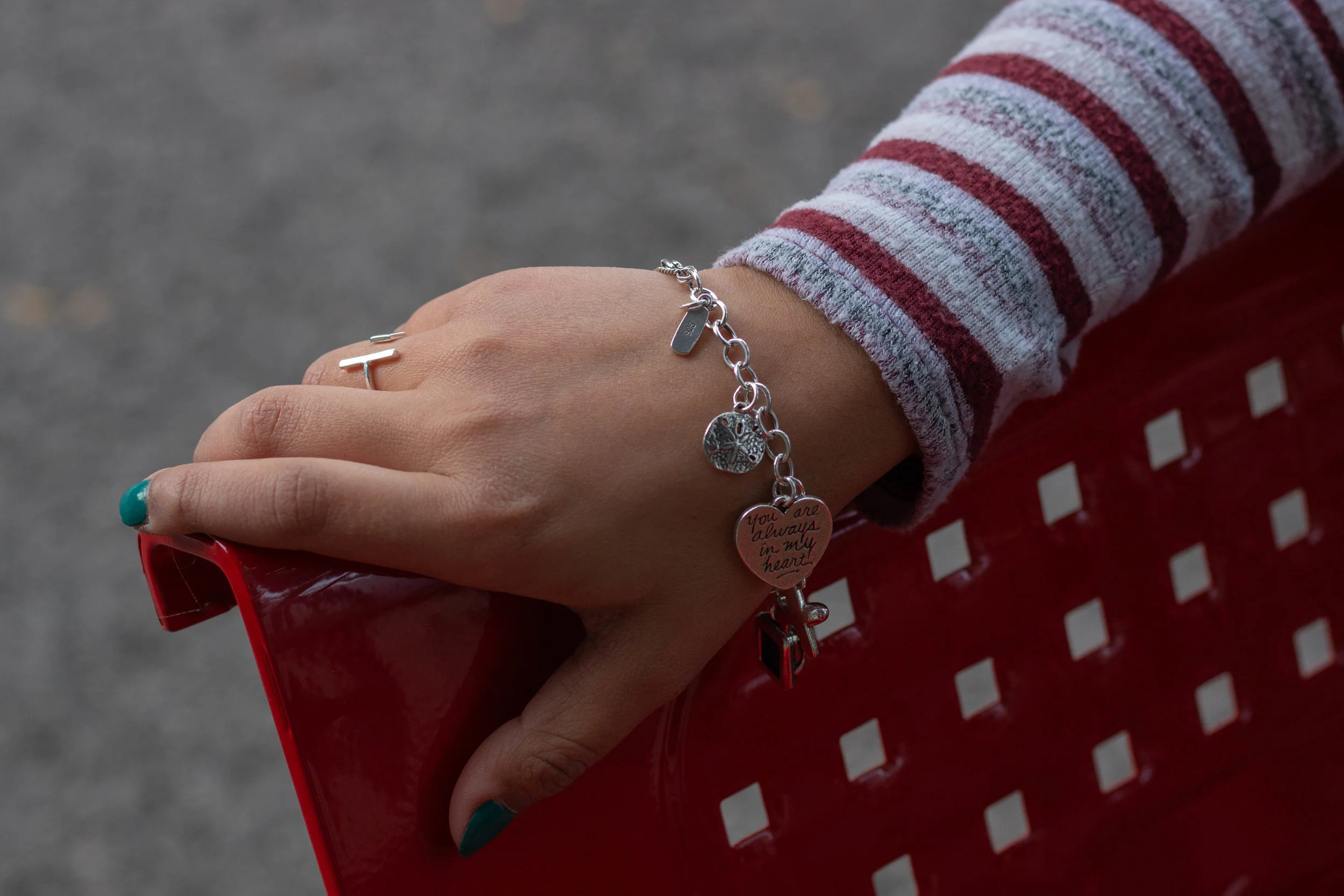 Samantha Chavez wears a bracelet adorned with personal silver charms.