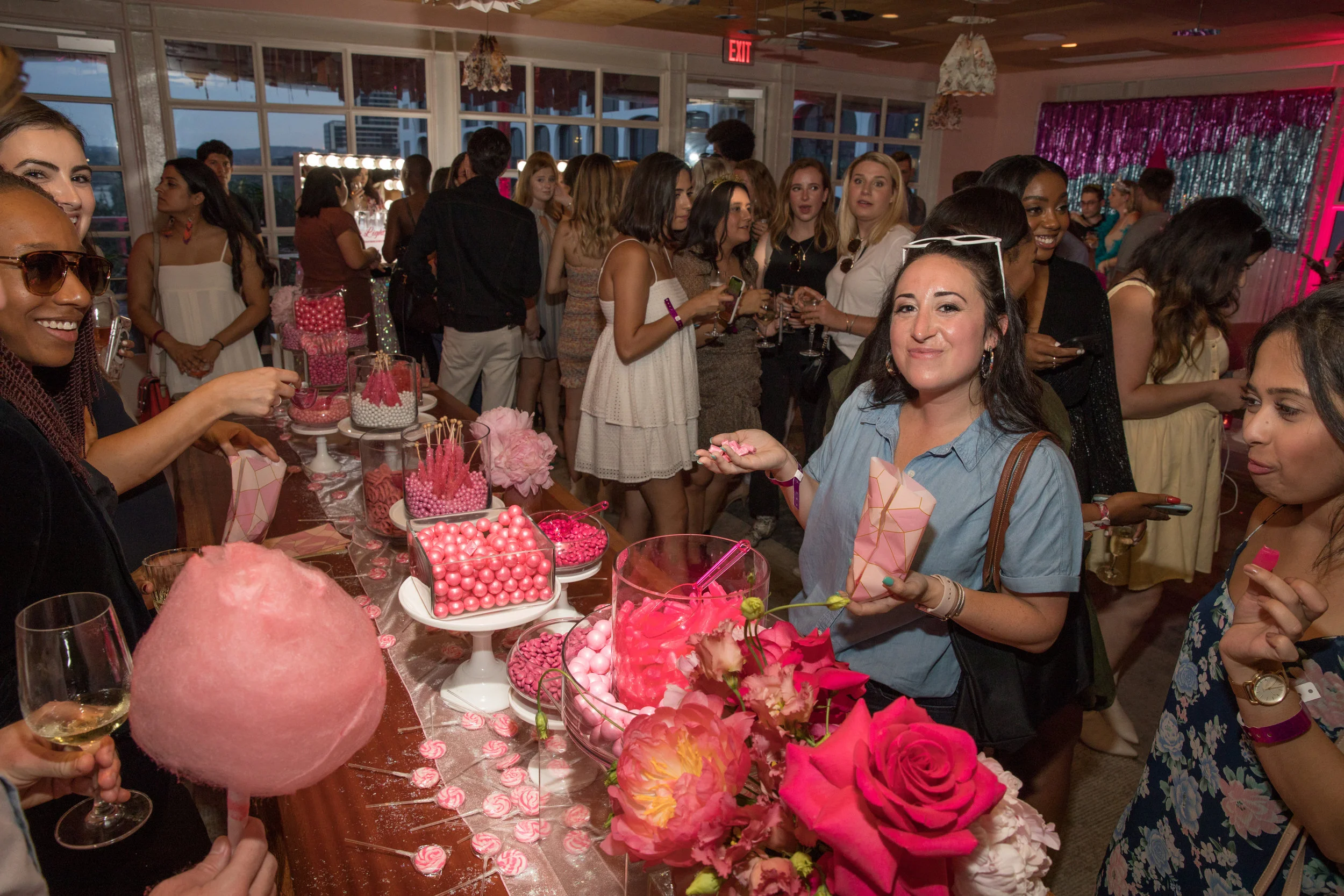Guests enjoy the neatly organized, all-pink candy bar.