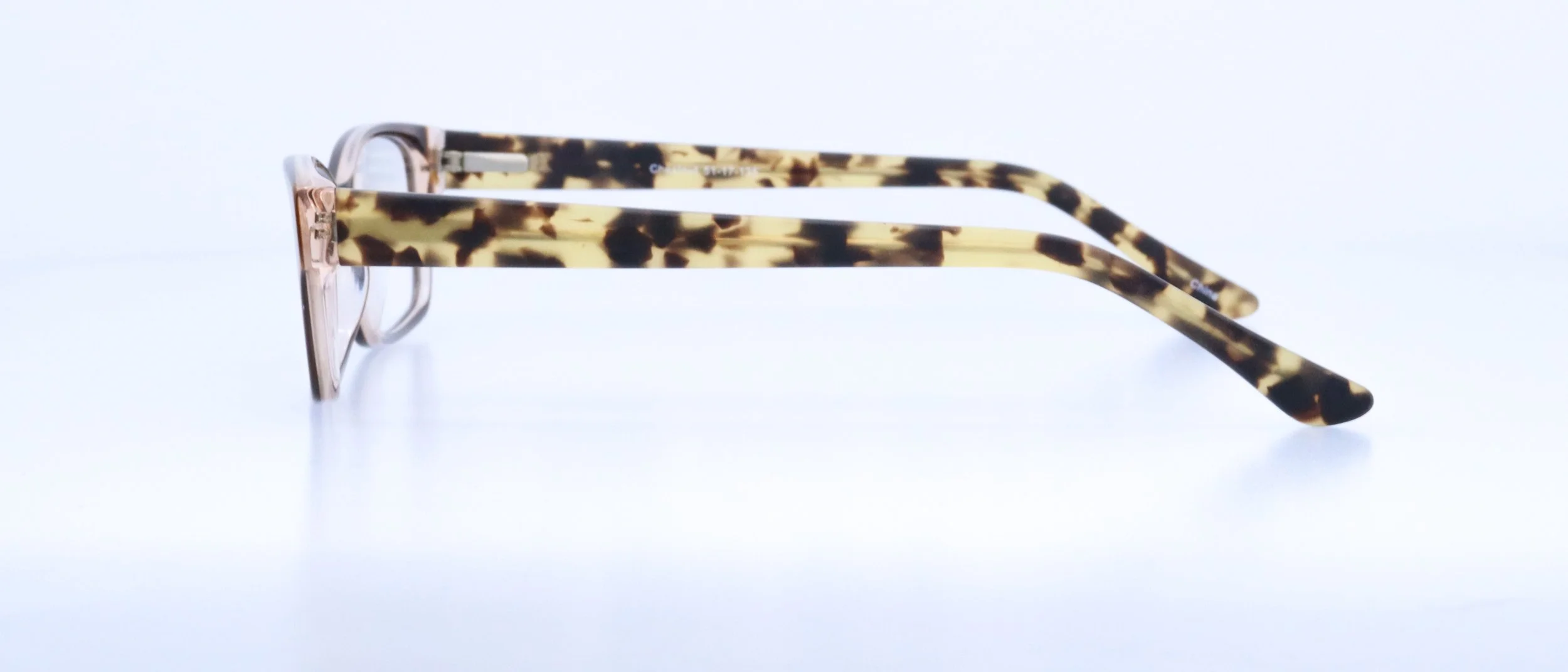  Flirty: 51-17-135, Available in Chestnut, Sapphire, or Tortoise/Purple 