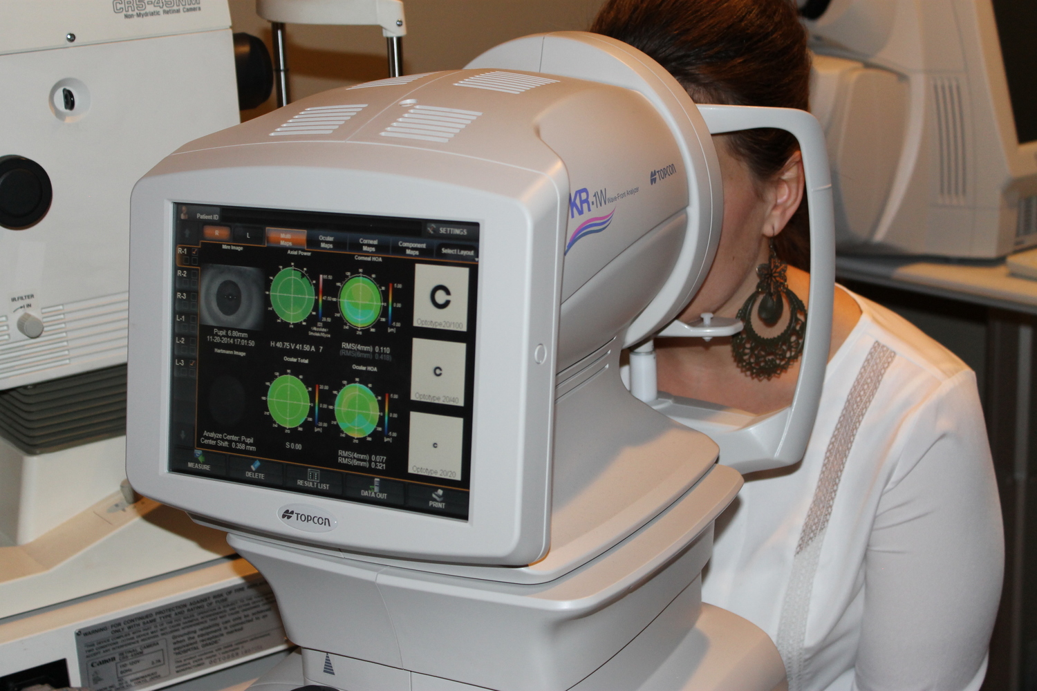 The TOPCON AUTO-REFRACTOR uses wavefront technology to objectively measure for your tentative glasses prescription. The information we receive from this instrument aids you in choosing your ideal digitally enhanced optics. In addition, it creates a map of your cornea (the clear window of the eye) to assist us in fitting contact lenses.