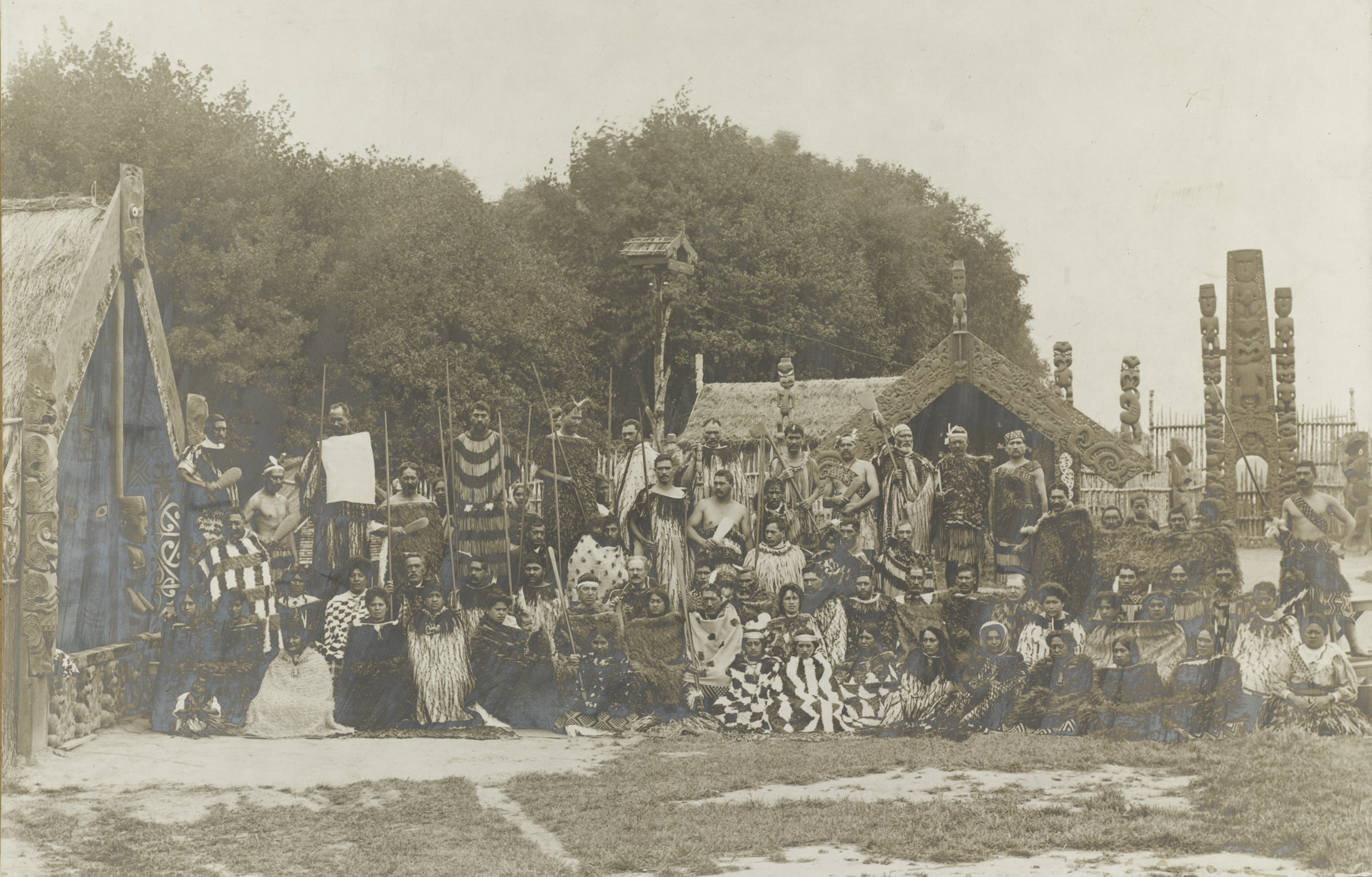 Group in ceremonial dress at the New Zealand International Exhibition, Christchurch, 1906-1907. Hocken Photographs Collection. James McDonald. Box-289-002.