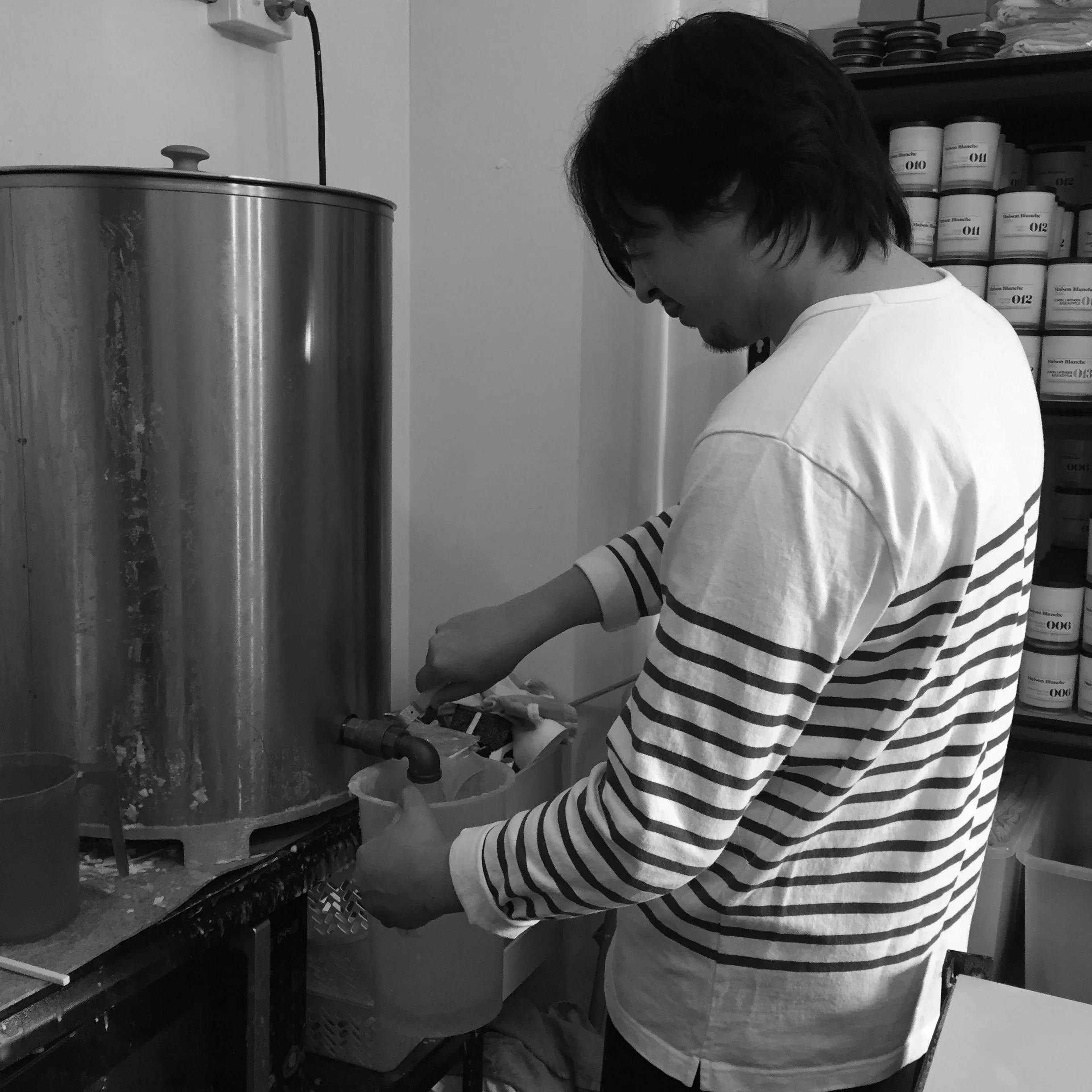 Mixing our fragrance with the melted soy wax.