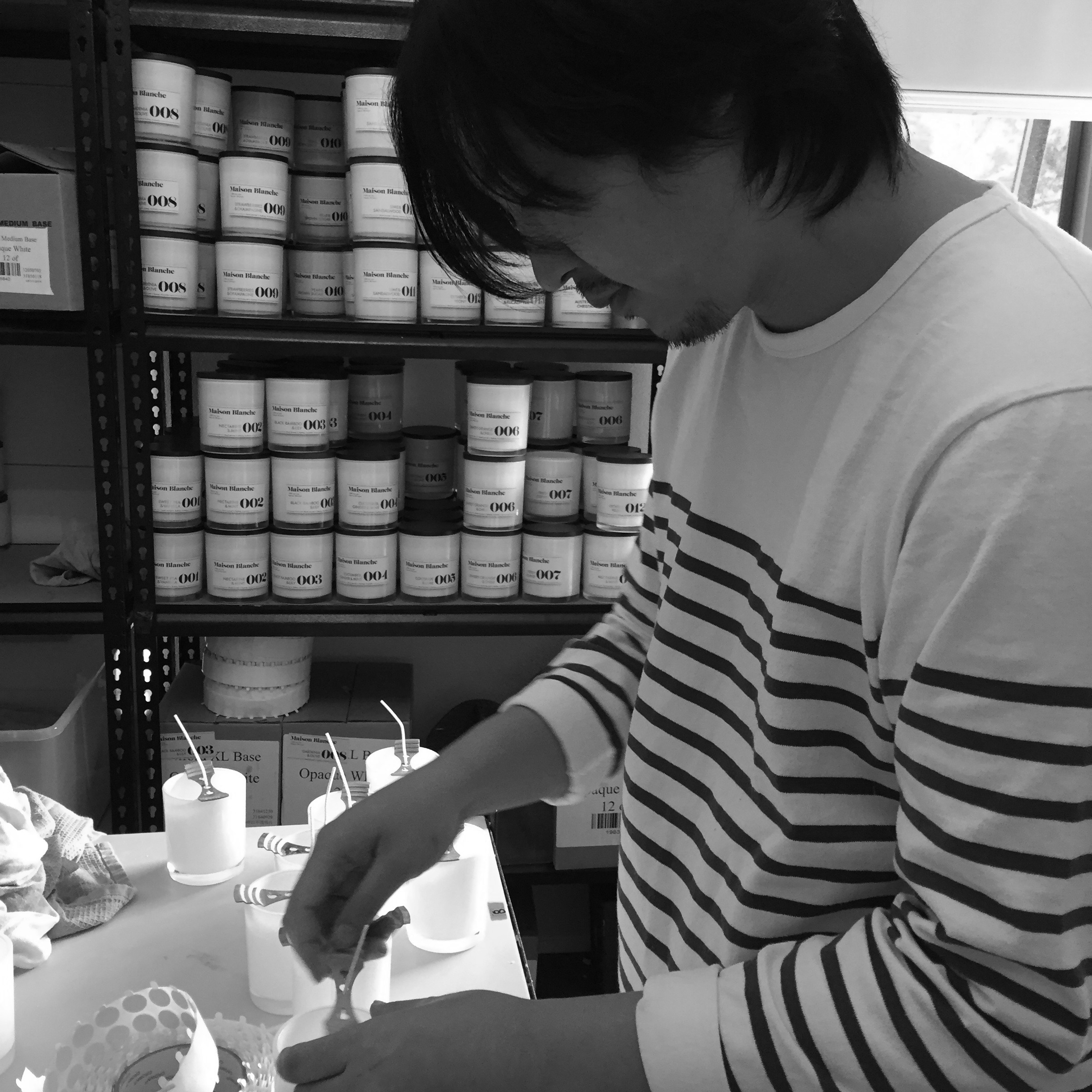 Nathan Lee, putting a whole lot of love into the production of these hand-poured candles.