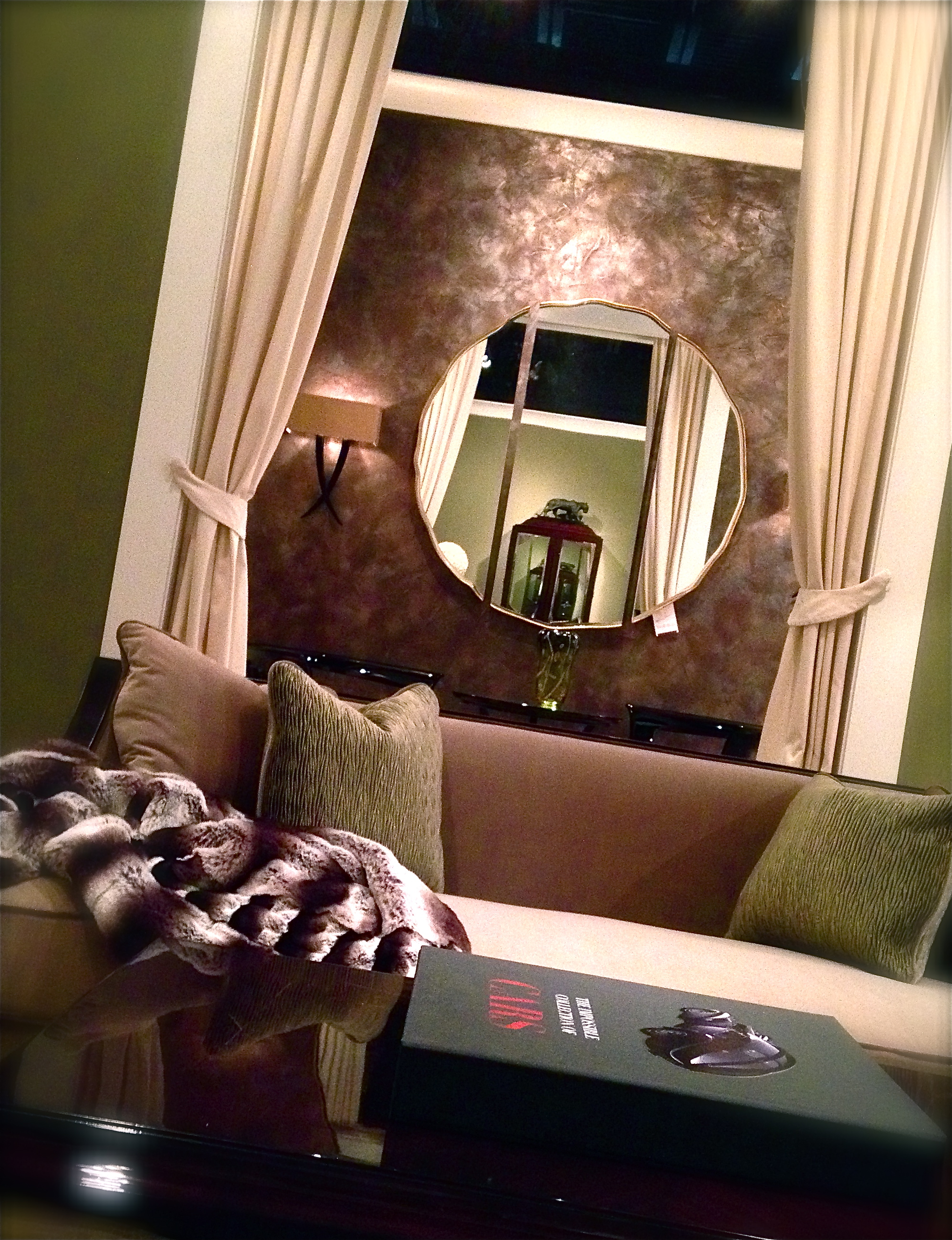 Designer, Jon Spurlock created an inspiring and inviting setting by incorporating a balanced mix of color and texture. By selecting a custom wall finish for the adjacent room, he achieved an extra layer of depth and texture while affirming color continuity between the two spaces. Guy Showroom - 2013 - High Point NC