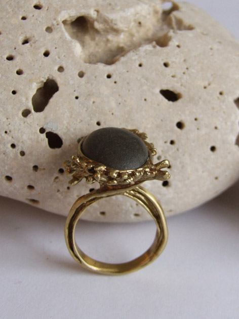 59 Seaweed man holding pebble ring.jpg