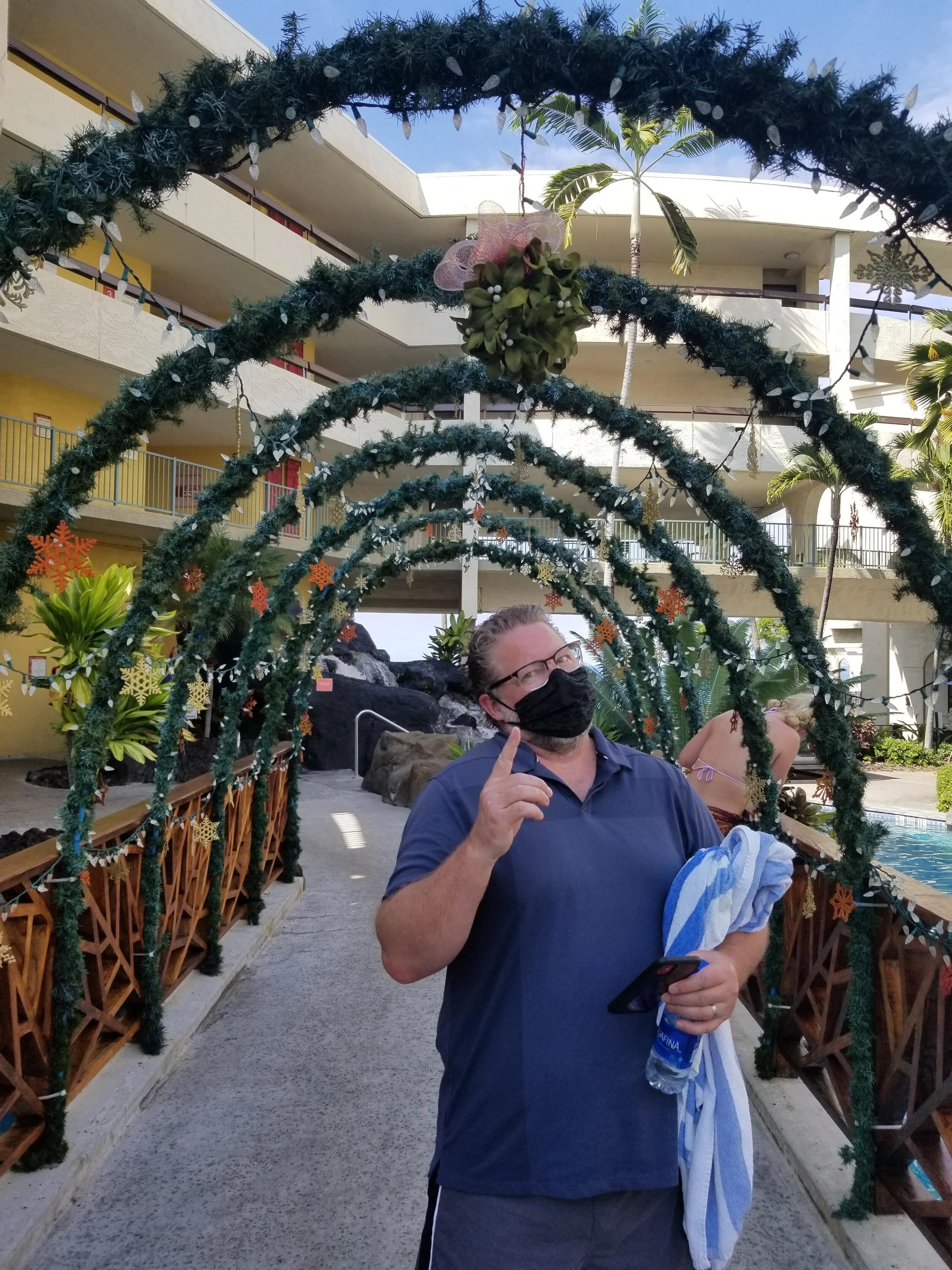 Husband under the hotel's mistletoe