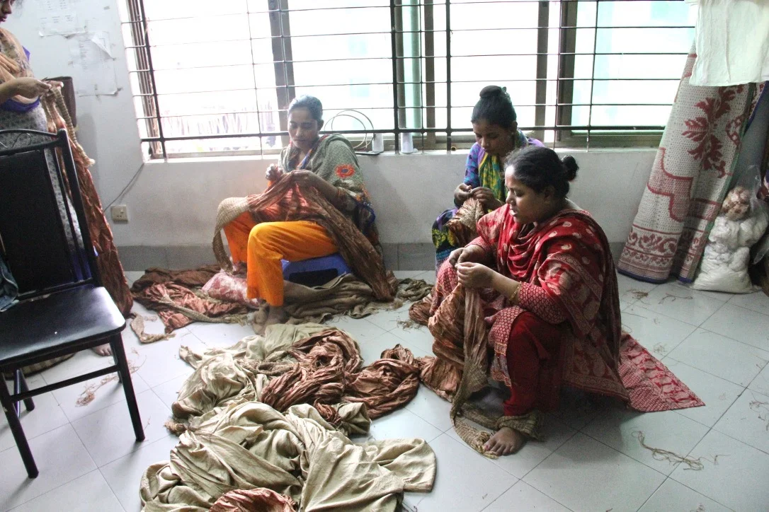 Workers in a small, ethically run fair trade workshop in Dhaka