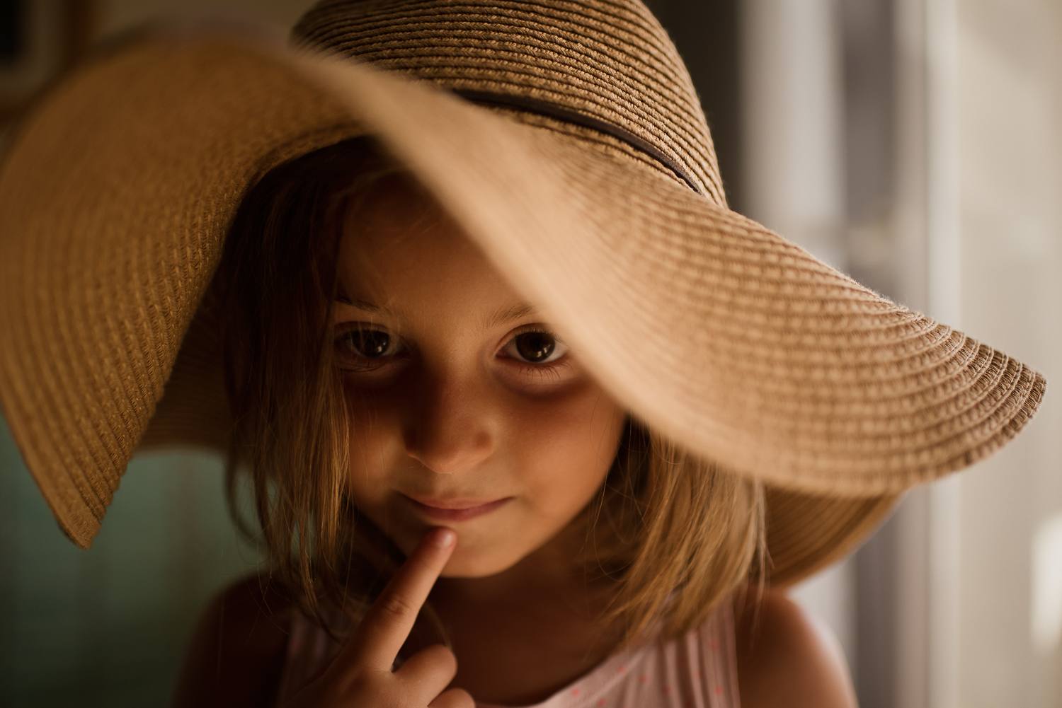7. Trying on mum's hat during our last summer holidays at the mediterranean beach of La Manga. I found this light and her gesture so gorgeous.