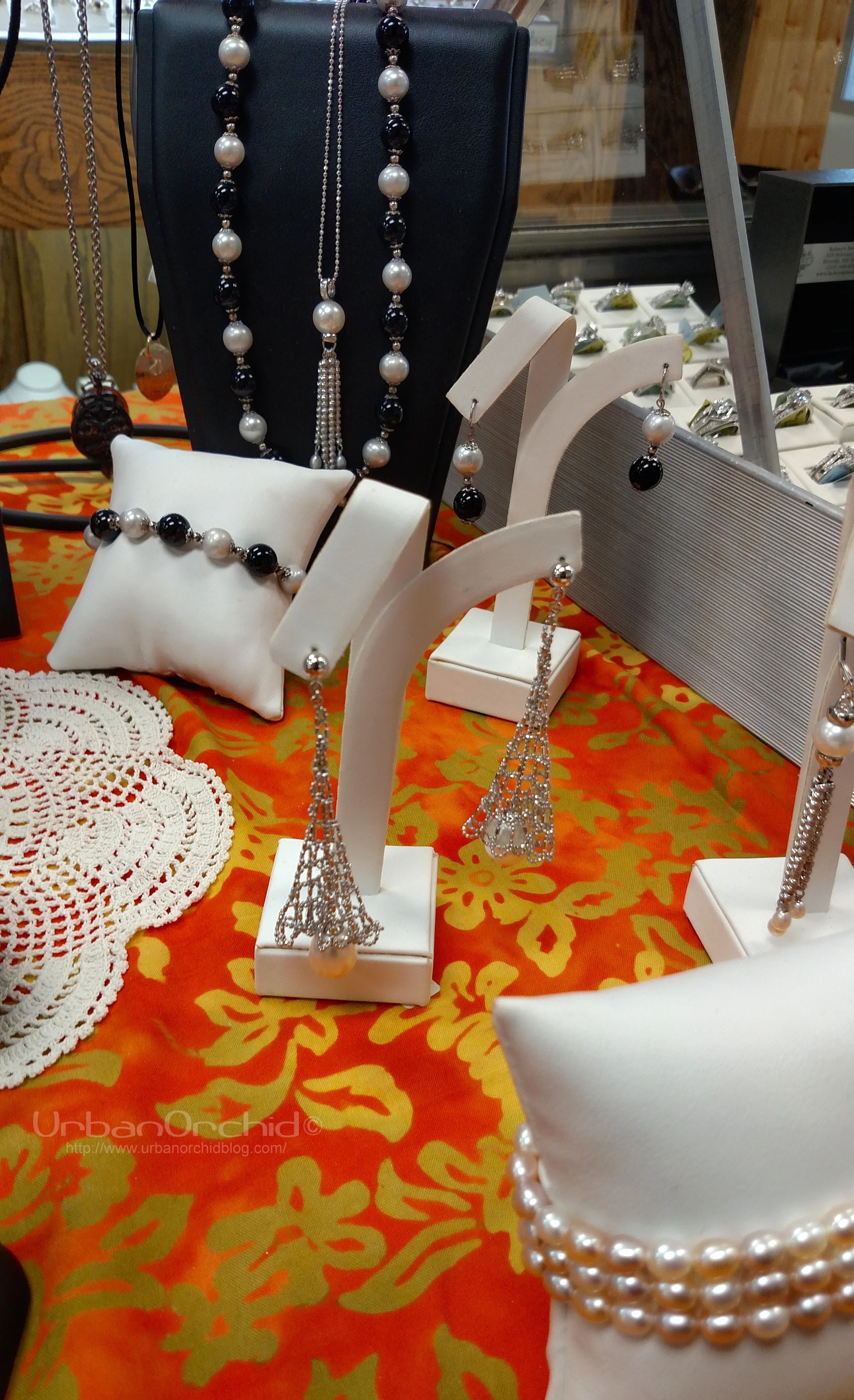 Pearl jewelry on the sales table. Love the beaded structure on those earrings.
