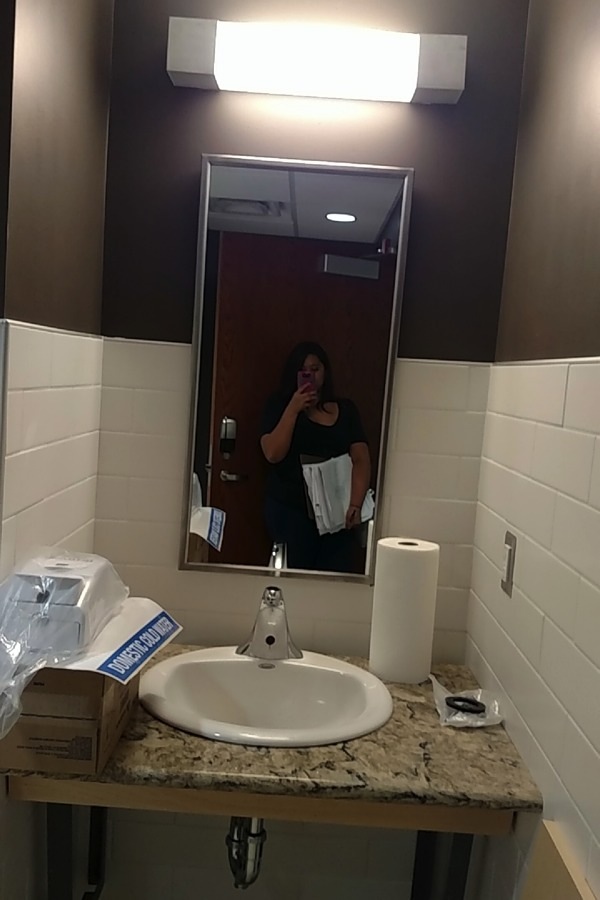 Checking receptacles and luminaires in a restroom.