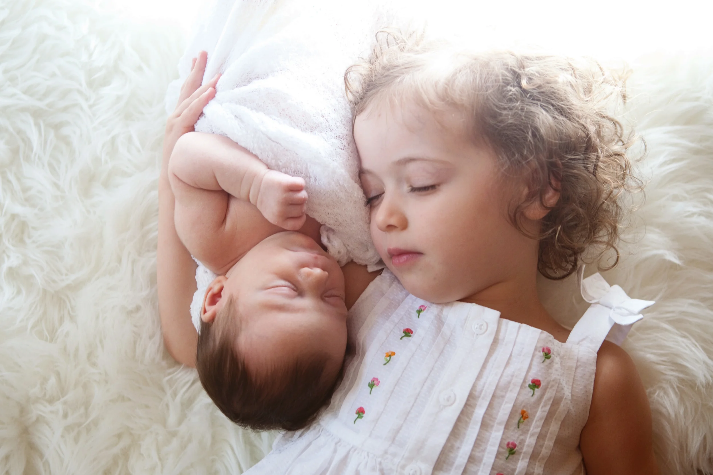 This is my favorite picture. It's so clear that K. already loves her sister unconditionally and really captures the big sister - little sister relationship so well.