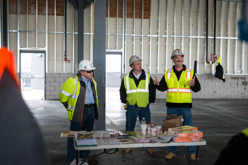 March Safety-OSHA: Director of Safety for March, Frank Brady (right) putting emphasis on the importance of harnessing.