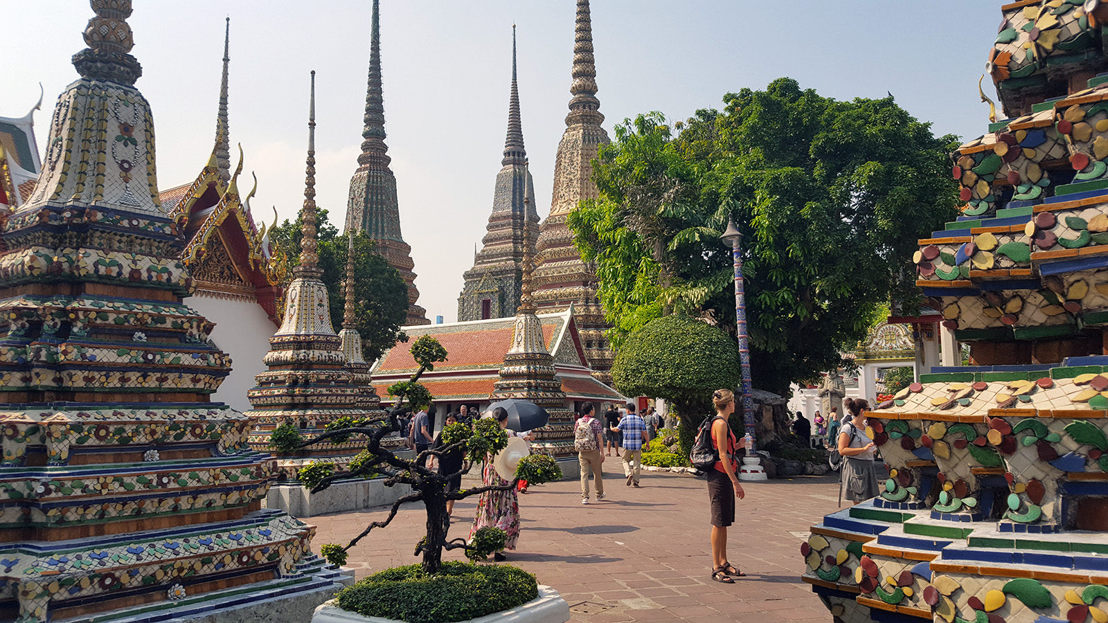 Wat Pho was our first temple experience in Thailand, and it was like walking into a secret temple garden. Only one wall divides the noisy streets and this peaceful sanctuary, that is lined with various pathways all leading to something all equally impressive as the last.