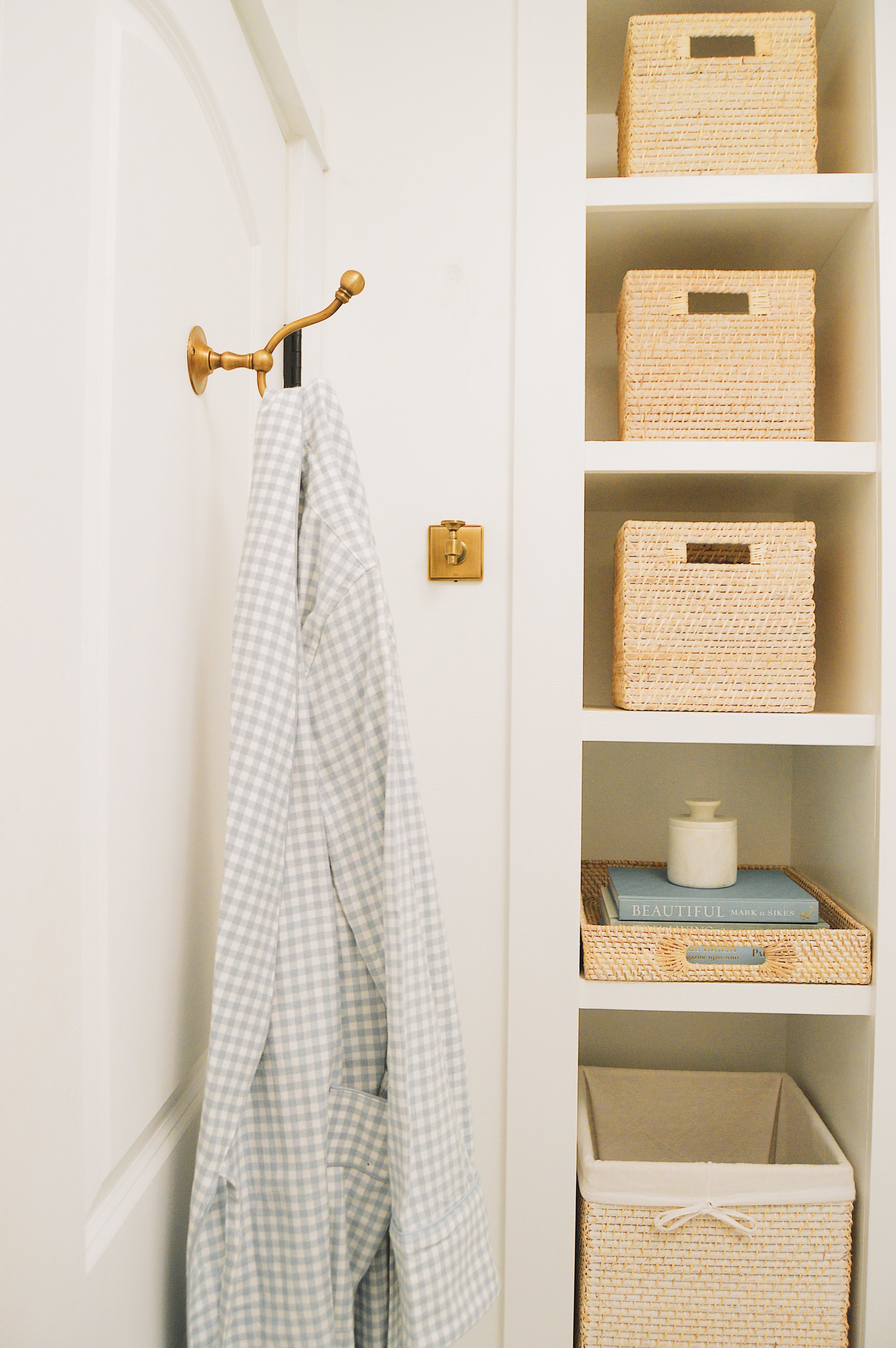  In our bathroom, I used these rattan handled bins to store my most-used beauty products.  