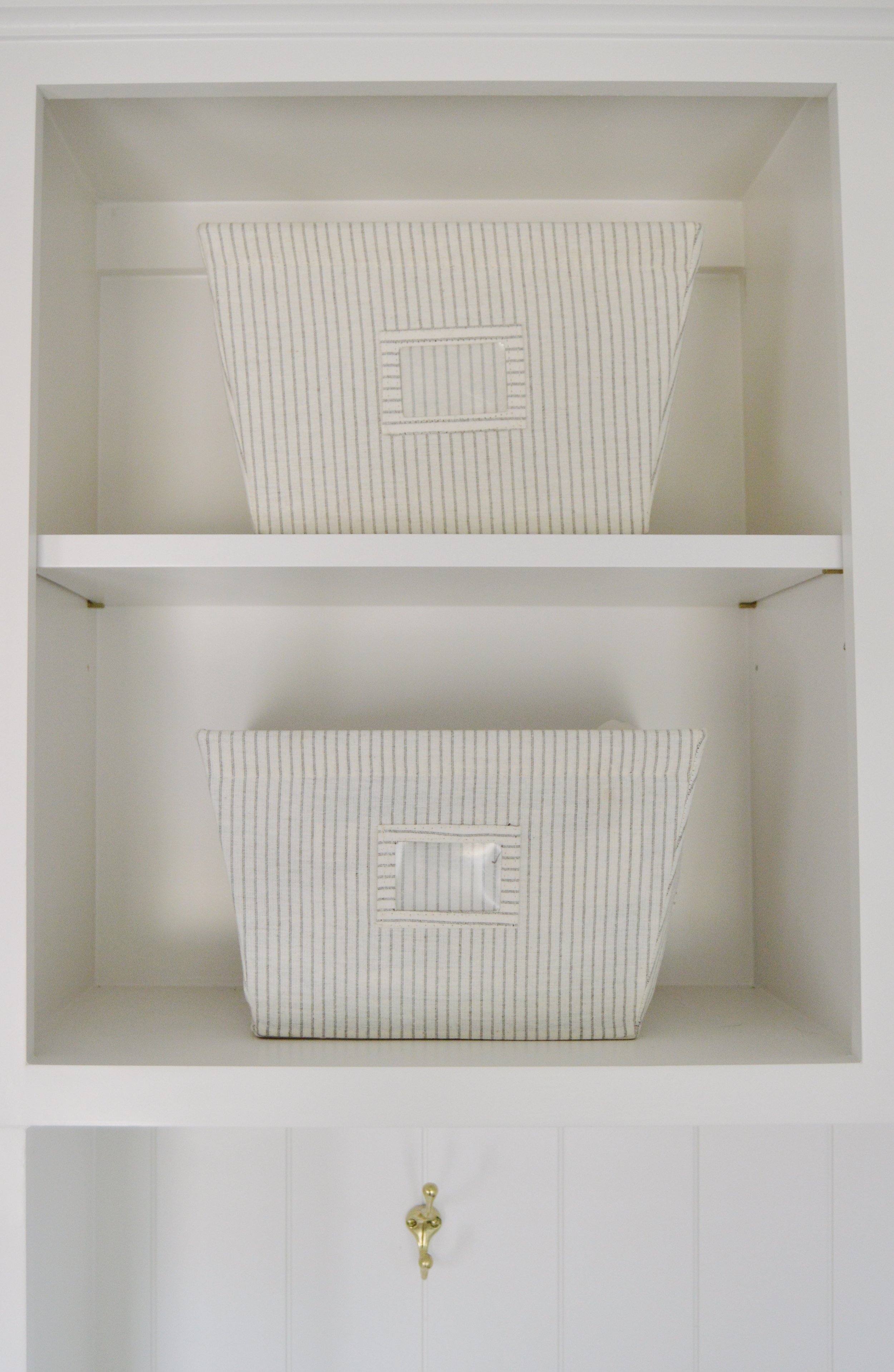  In our Mudroom (reveal coming soon!) I used these striped linen bins to store dishtowels  