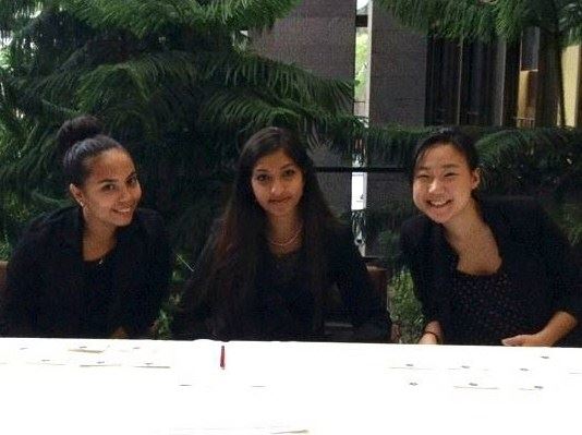 Marcella (YB-NY '16), Mahin (YB-NY '15), and Karen working the sign-in table at the launch of "America By the Numbers."