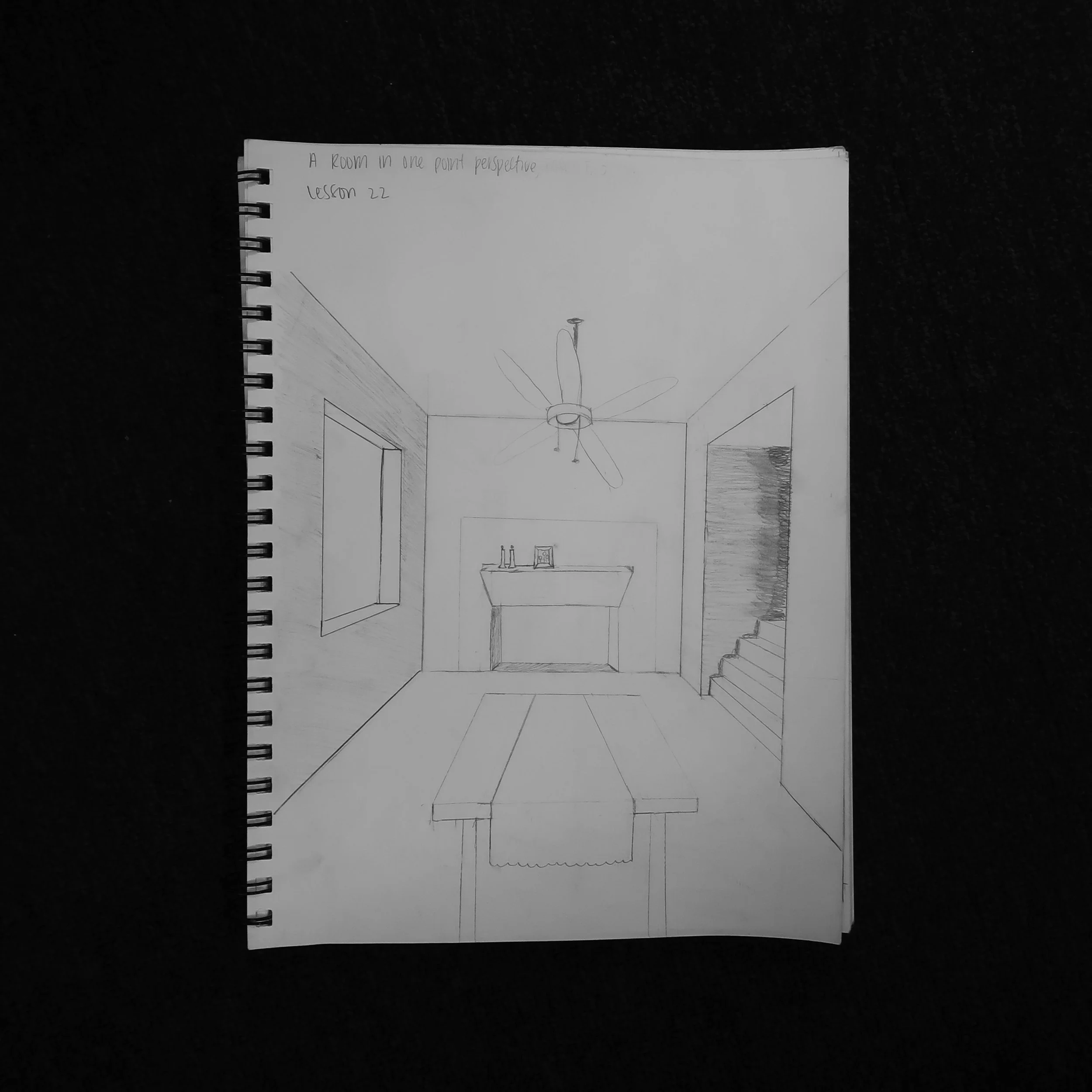 This was my second take of a room in one-point perspective. I struggled HARD with that ceiling fan but otherwise, I really liked the perspective lessons in this book!