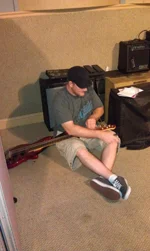Derek stringing up da bass so he can slappa da bass mon!