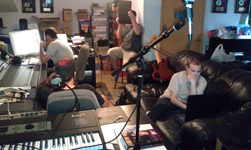 The "connected generation," with Derek hiding behind his iPad; a true victim of the paparazzi.