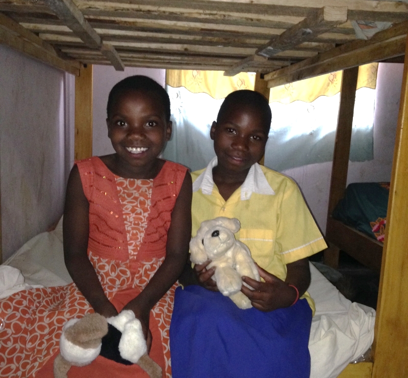 Ester (left) and Grace (right) sitting on their new bunk-bed