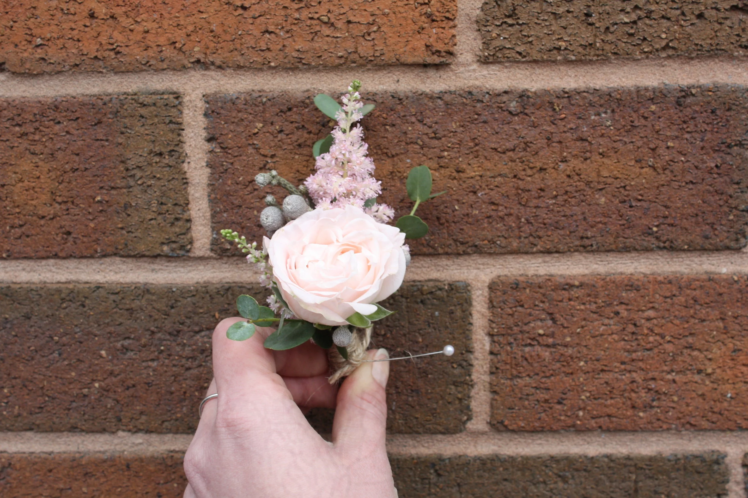 buttonholes jess and sam.JPG