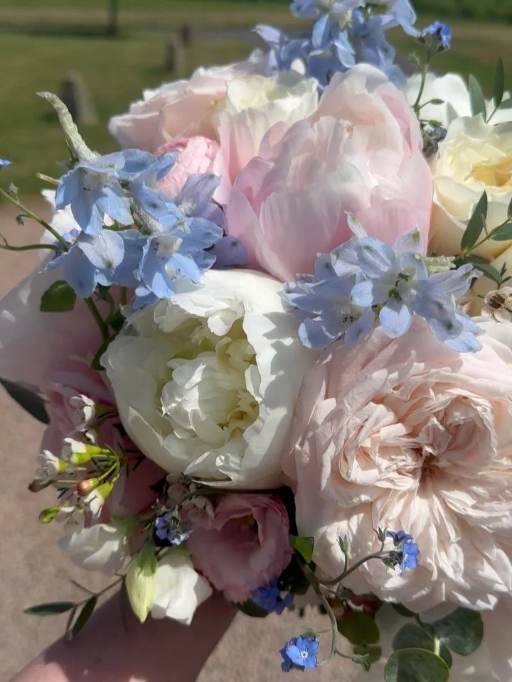 Jenny&rsquo;s beautiful wedding bouquet full of peonies, roses, ranunculus, delphiniums, forgot me knots, wax flowers and sweetpeas 💕