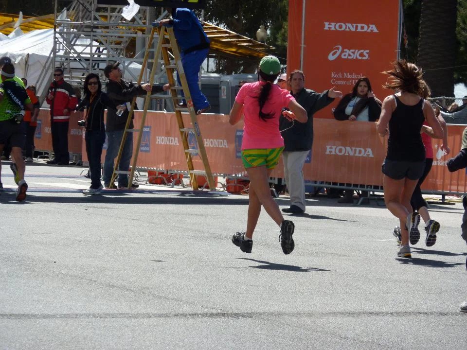 LA Marathon// 2012- the finish looked better than the last six miles..... also my hair made itself into one big dred.