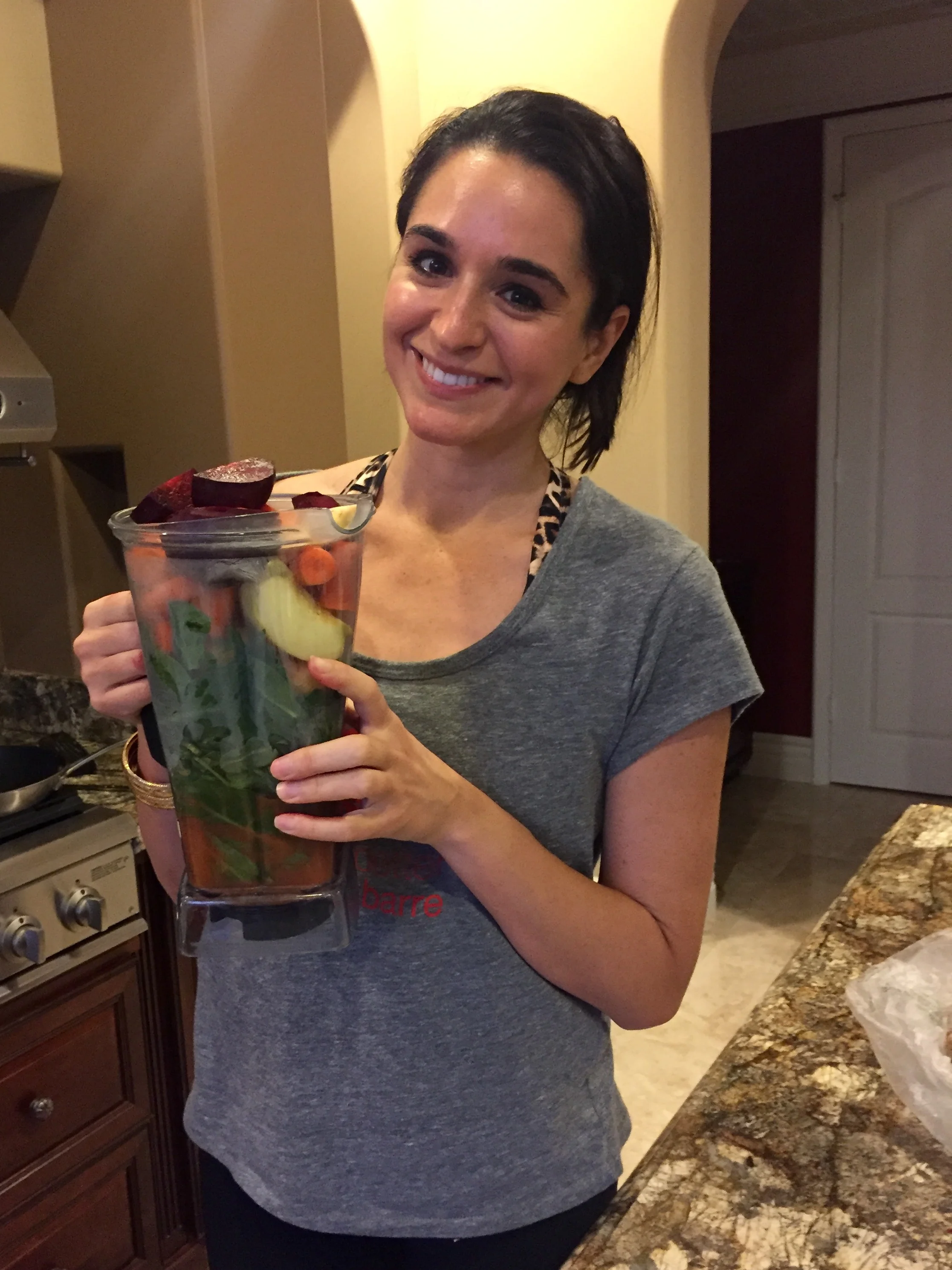 my every morning breakfast drink ;-) there's spinach, kale, chard, apple, carrots, beets, ginger, & mango in it. Tyler LOVES it when I share some with him. Ha. 