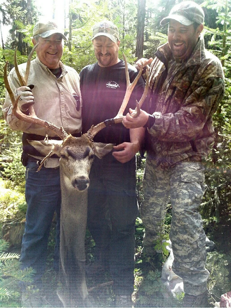 Father and Sons enjoy the harvest of a tough hunt