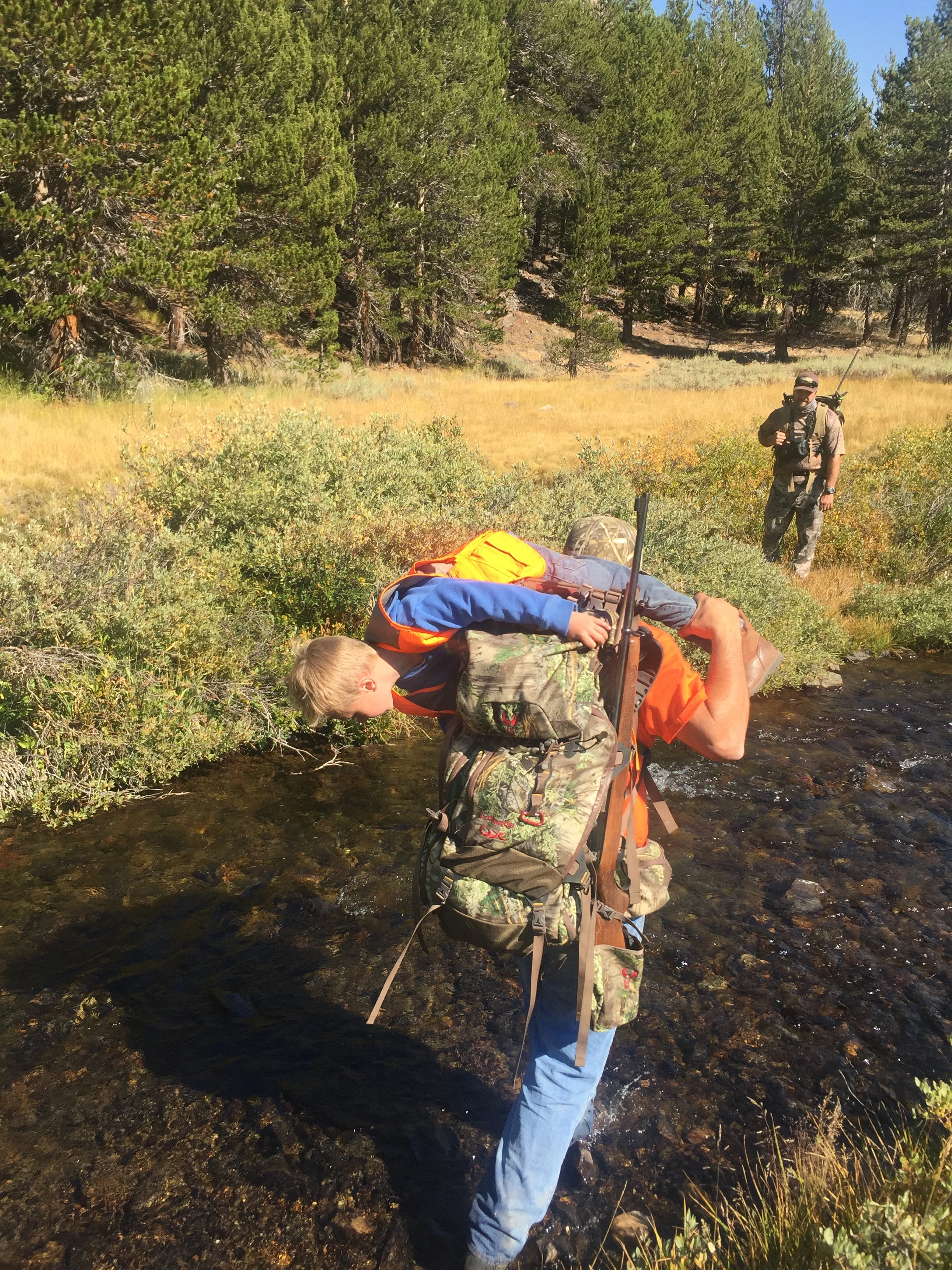 Helping my boy cross the creek