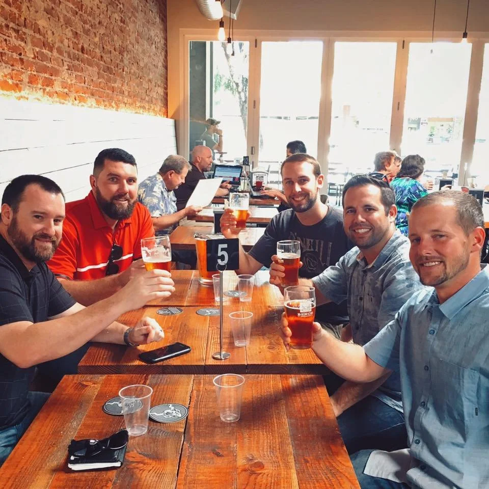 People enjoying craft beer at Burger Bench Escondido